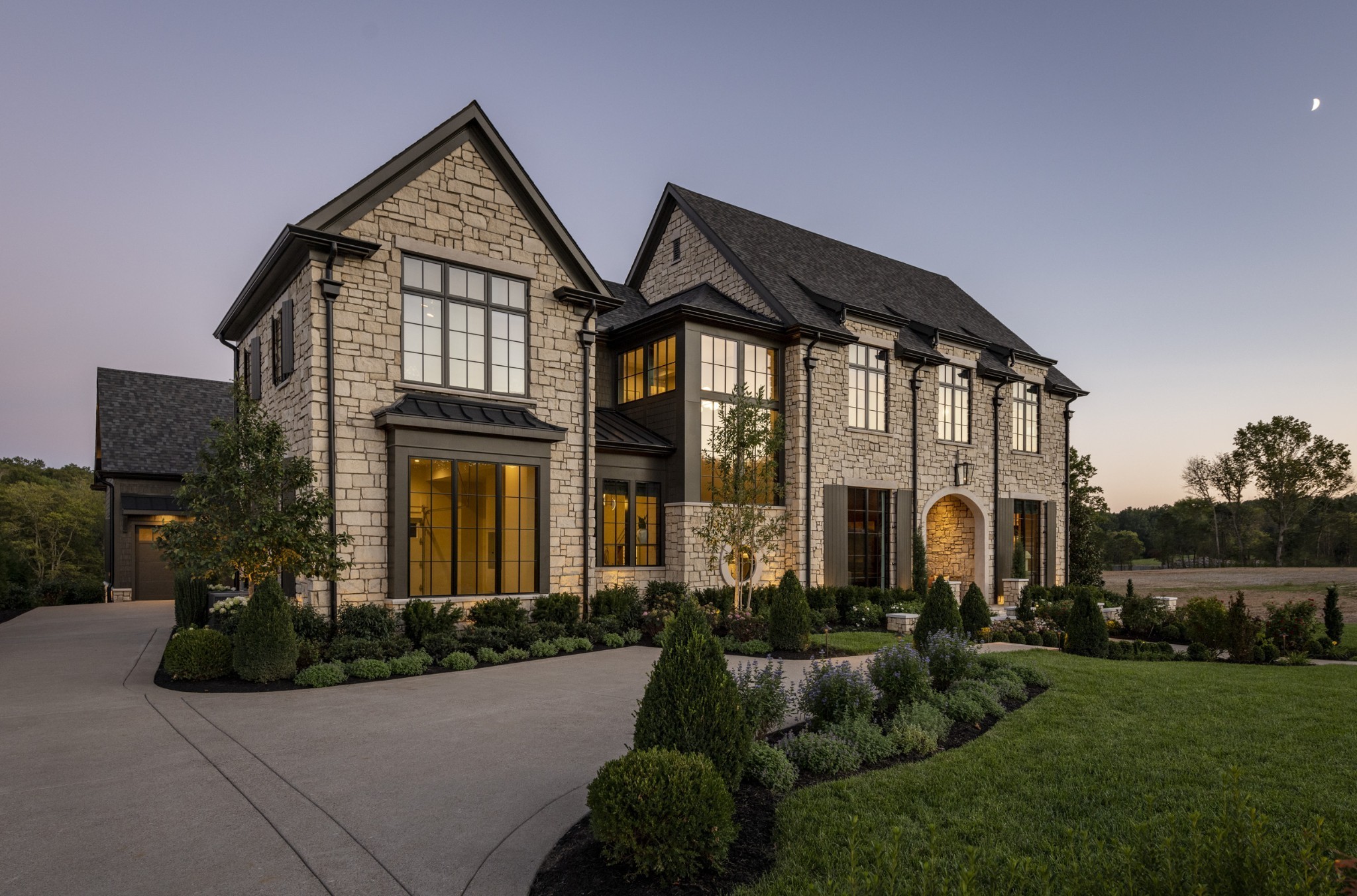 Cutting-edge design with a unique blend of natural and modern element by Stonegate Homes- This is your chance to call a BRAND NEW 2025 PARADE HOME your own. Gorgeous stone exterior welcomes you. From the front door, look through the vaulted Great Room to see your own personal backyard retreat, including a custom pool & spa with water features, fire bowls, and an infinity edge, a fire pit, putting green, grill station, and year-round covered porch. 5 Bedroom suites with their own private bath. Home elevator. Control 4/Lutron lighting throughout. Media Room on main level features stone-milled wall & wet bar. Bonus room & separate flex space on upper level. Two laundry rooms. Main Kitchen houses separate islands, Wolf & Subzero appliances, PLUS separate prep kitchen and Wet Bar conveniently located off the kitchen. With each corner looking like a magazine shoot, you have to see this home to believe it! Proof of Funds/pre-approval required to show.