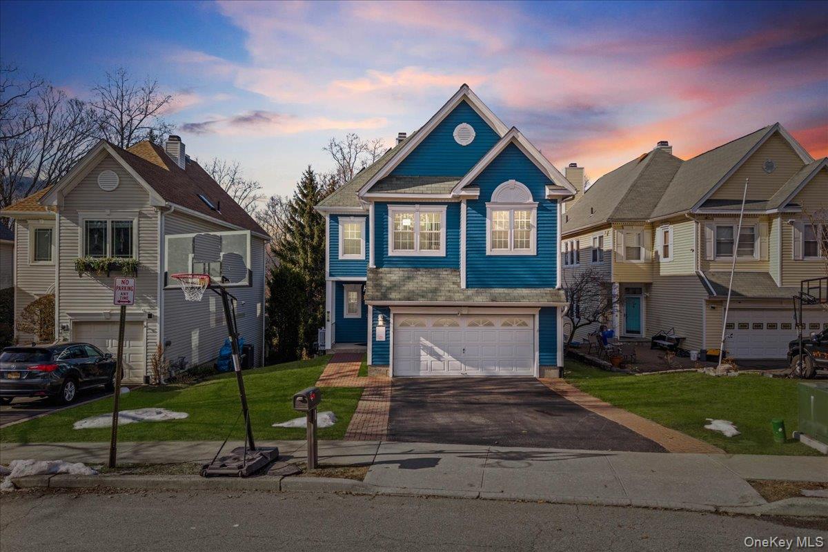 **Welcome to 192 Benefield Blvd, Peekskill, NY** — a spacious 4-bedroom, 2.5-bath Colonial in the desirable Forest View neighborhood offering comfort, style, and energy efficiency.The bright main level features hardwood floors, a formal living room with fireplace, formal dining room, and a large family room off the kitchen with access to the deck—perfect for entertaining. Upstairs, the primary suite offers vaulted ceilings, a walk-in closet, and a spa-like bath with soaking tub, separate shower, and double vanity. Three additional bedrooms and a full hall bath complete the second level, while the finished walkout basement provides flexible space for a recreation room, gym, office, or guests.Step outside to your private backyard retreat featuring a **heated above-ground pool**, perfect for summer enjoyment. The home also includes **fully paid-off solar panels**, providing valuable long-term energy savings.Located in vibrant Peekskill, you’ll enjoy Hudson River waterfront parks, a thriving arts and dining scene, and easy access to the Metro-North Railroad Hudson Line for a scenic commute to NYC. A fantastic opportunity to enjoy space, convenience, and the Hudson Valley lifestyle.