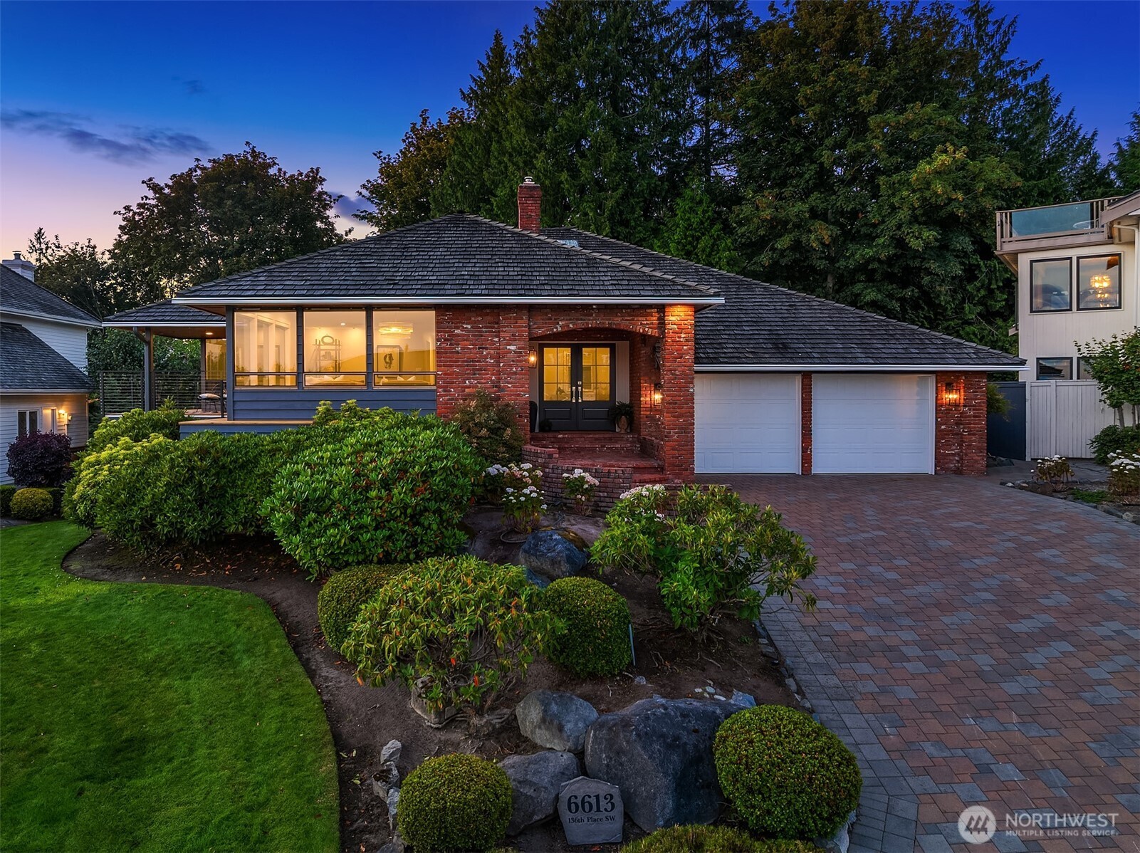 Move-in ready & meticulously remodeled, this Picnic Point rambler delivers the perfect blend of comfort & elevated, modern finishes. Perched on an exceptional view lot, the home boasts panoramic Sound views from nearly every room & multiple view decks.The main floor features a primary suite w/ a fully remodeled ensuite bath, plus an open-concept living area bathed in natural light, now showcasing hardwood floors throughout, fresh interior & exterior paint, new stair railings, and designer lighting including a stairwell chandelier, dining & living room chandeliers, and can lighting in every room. The updated kitchen area connects seamlessly to a new wine storage nook w/ glass doors, while a remodeled powder room & main bath vanity add everyday polish. A built-in Murphy bed/bookcase system adds smart flexibility for guests or a home office.The versatile lower level has been transformed with a newly painted fireplace & powder-coated fireplace enclosure, refreshed laundry room, bathroom & bar cabinets, and new ceiling lighting throughout—ideal as a rec room, office, or additional guest space.Major system upgrades include all-new electrical outlets, an integrated whole-home generator, and updated HVAC for year-round comfort & peace of mind.Outside, enjoy a private hot tub, refinished deck & railing, new backyard fencing, and updated front & side entry doors—all surrounded by a lush greenbelt backyard offering privacy, space for gardening, and room to relax or entertain.