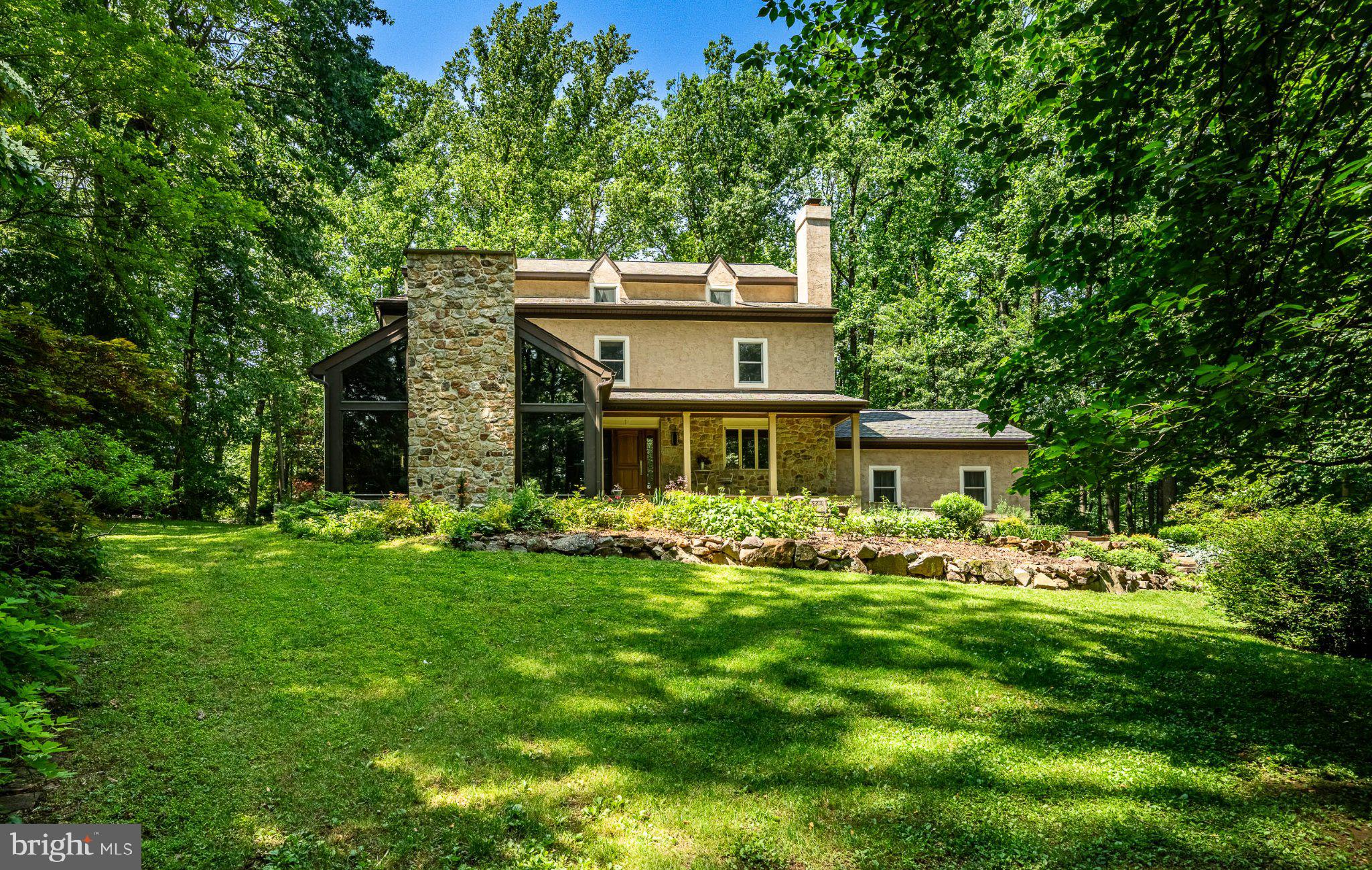 Welcome to 632 Greenridge Road, an impeccably maintained private hilltop retreat offering a lifestyle of luxury, peace, and serenity, surrounded by nature. In a world moving faster than ever, finding stillness away from it all is the ultimate modern indulgence, and this home delivers it effortlessly, set on 2.1 private, wooded acres where every day feels like an escape. 5 bedrooms, 3.5 baths, 7,853 Total sqft from top to bottom with unparalleled features & amenities you will not find in your average home.Greeted by beautifully curated gardens and natural hardscaping, the entrance is idyllic with a PA bluestone staircase, lit beneath each step, leading to a relaxing covered front porch. Step into the foyer, where one side leads to a den with a wood-burning fireplace and built-in shelving, while the other side of foyer steps down into a breathtaking great room. This exceptional room is defined by soaring cathedral ceilings and a full-profile stone fireplace flanked by windows that frame the private surroundings for a space that instantly puts you at ease while enjoying views of every season. Adjacent to this room sits an elegant formal dining room ideal for hosting large gatherings and flows seamlessly into a sprawling kitchen.The gourmet kitchen is the true heart of the home, built for culinary enthusiasts and effortless entertaining alike. Designed for two cooks, it features a 10-foot island with bar seating for six, a sleek industrial-grade range hood over a 6-burner Thermador professional gas range (with 2 XO burners and a center grill), a Fisher & Paykel double wall oven with Thermador warming drawer, GE Monogram refrigerator, and Bosch dishwasher. Two full-size sinks separate prep from cleanup, while 36-inch solid quartz countertops offer ample workspace. KraftMaid solid Beechwood cabinetry delivers endless storage, 2 appliance cabinets, 2 pull-out pantries, deep drawers, and a planning desk with filing cabinets, finished with dual pocket doors that open to a full walk-in pantry for effortless organization and flow. With ample room for a large table for everyday dining, this space opens directly to a large screened porch, complete with its own wood-burning fireplace and accent lighting, perfect for moving guests from indoors to out, day or night.For buyers thinking long-term, this home offers something truly rare: a private elevator accessing all four levels- basement to third floor- with zero floor transitions, delivering true wheelchair accessibility without ever sacrificing style. The home features a main-level bedroom with its own full bath, ideal for guests or multi-generational living. Ascend to the upper level to find an expansive owner's suite filled with natural light and enhanced by a true spa-like en suite bath: a walk-in shower with dual shower heads and a center rainfall head, separate vanities, two individual water closets, a relaxing Lasco soaking tub with champagne bubble jets and mood lighting, a warm gas-burning fireplace, and a massive walk-in closet, an everyday retreat unto itself. The second floor adds three more bedrooms, a hall bath with tub/shower combo, and a laundry room for ultimate convenience.Truly setting this home apart, a full third level is a blank canvas of possibility. Although unfinished, it is wired for HVAC and ready to become additional bedrooms or a private suite or loft. With elevator access, 8 lighted storage alcoves, and a built-in pull-down staircase to the attic above, this 980 sqft space offers room to grow for years to come.Everyday needs are just minutes away including Marsh Creek State Park, the charm of Ludwigs Corner, and the small-town warmth of Eagle, with Eagleview and Exton offering every convenience close by. Add the highly rated Downingtown School District, and this address delivers exactly what every buyer is searching for: seclusion without sacrifice. 632 Greenridge Road is more than a home, it's an invitation to slow down, live well, and finally exhale.