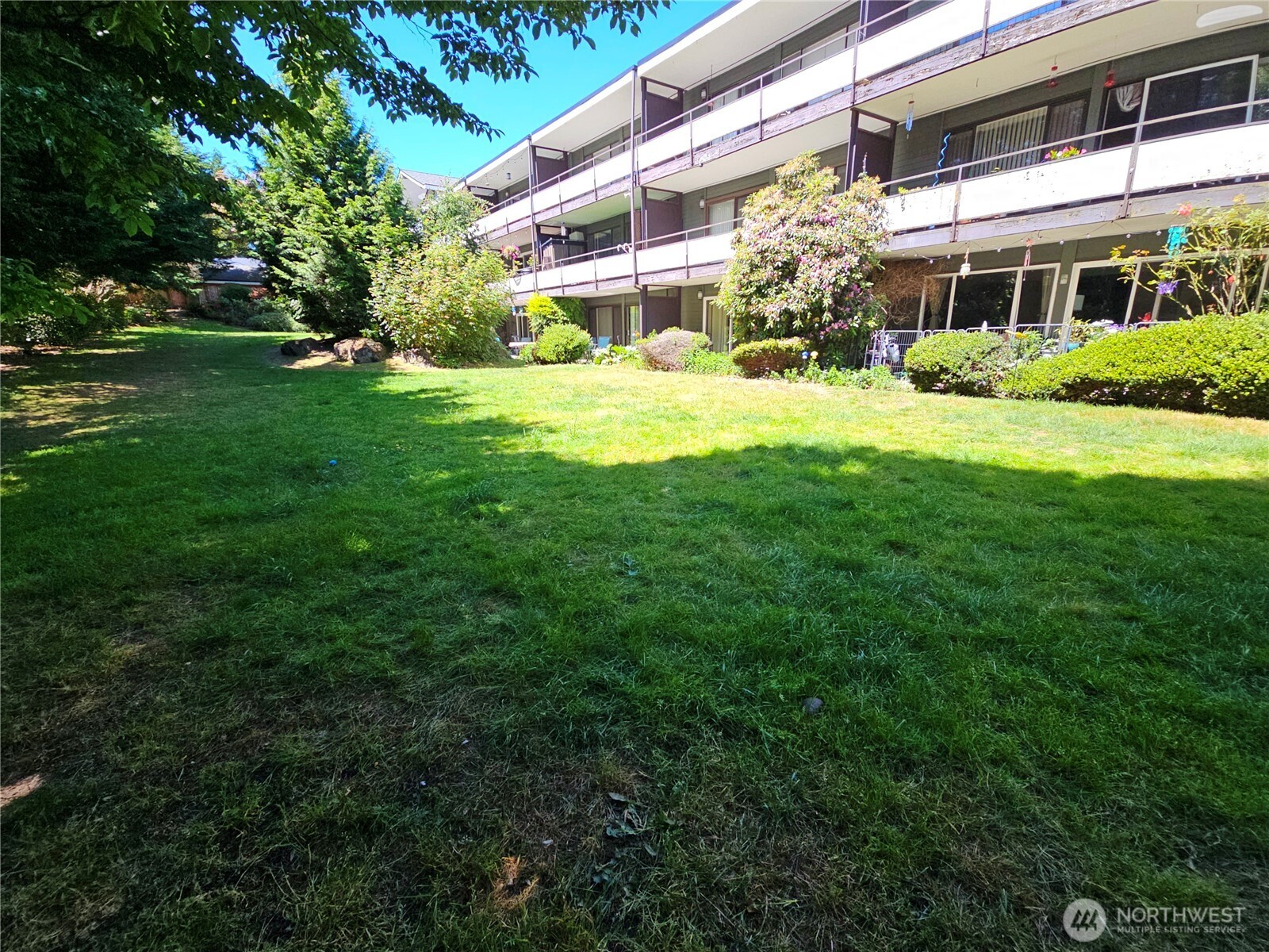 *Price Improvement!  Seller to pay Special Assessment at closing.*  Charming ground-floor condo in beautiful Edmonds, WA! Enjoy the ease of single-level living and the rare luxury of an expansive, private patio that opens to a large, serene lawn. Tucked away for peace/quiet. Features brand-new baseboard heating and updated insulated windows for year-round comfort & efficiency. Open living space flows seamlessly to the outdoor area, ideal for relaxing, gardening, or entertaining. Located near shops, parks, and transit, this pet-friendly condo offers a unique blend of convenience, comfort, and quiet outdoor living. 8 minutes to Edmonds Beach, off-leash dog park, and ferry! Next to Edmonds-Woodway High. Minutes to Swedish Edmonds & I5!