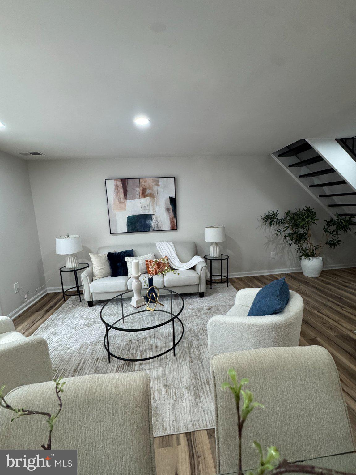Beautifully updated two-level townhouse in the desirable Reston community! This move-in-ready home features two bedrooms and two-and-a-half bathrooms with modern updates throughout. The main level offers a bright and inviting living area, an updated kitchen, and a dining space. Additional improvements include refreshed bathrooms, newer flooring, recessed lighting, modern fixtures, and a newer HVAC system. Enjoy a huge patio with a private fence in the back surrounded by mature trees.The home includes two reserved parking spaces directly in front for everyday convenience, along with nearby visitor and street parking. Walk to the local elementary school and take full advantage of everything Reston has to offer—55+ miles of scenic trails, 4 lakes, 15 pools, 50+ tennis and pickleball courts, plus numerous parks and community centers. Ideally located near Reston Town Center, the Silver Line Metro, Washington Dulles International Airport, and major commuter routes, this is an exceptional opportunity to own in one of Northern Virginia's most sought-after locations!