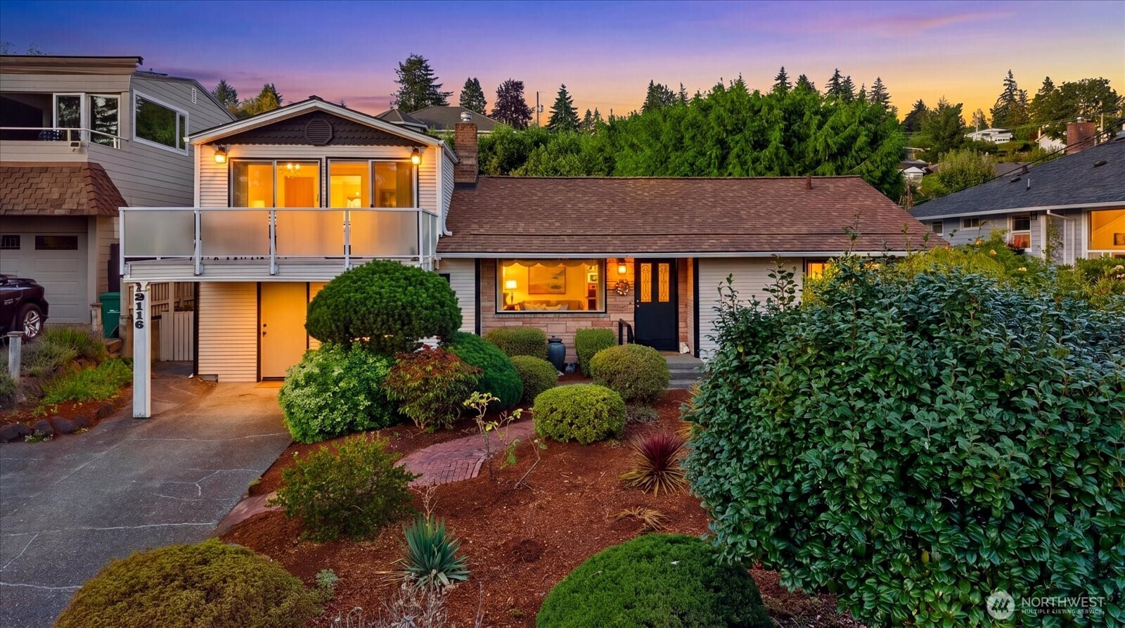 Welcome to Shorewood, where peaceful surroundings, beautiful Views, and a wonderful sense of community come together. Tucked along a quiet street in one of Burien's most desirable neighborhoods, this inviting home offers a wonderful combination of comfort, character, and an exceptional setting. Residents have the option to join the neighborhood beach club, offering private beach access and a calendar of community events. Upon entering, you're welcomed by a gracious formal living room featuring beautiful hardwood floors that continue throughout the main level. At the heart of the home, the kitchen opens seamlessly to the great room, creating an inviting space for everyday living and entertaining. Built-ins and a cozy fireplace add warmth and character to the space. Upstairs, the spacious primary suite offers a peaceful retreat with incredible views of Puget Sound and the Olympic Mountains. Step outside onto the private deck to take in the scenery. Beautiful custom lighting in warm gold finishes adds an elegant, thoughtfully curated touch throughout the home.  The backyard is a true sanctuary, surrounded by mature landscaping & thoughtfully planted gardens. A tranquil koi pond adds to the peaceful atmosphere, creating a setting for relaxing, entertaining, and enjoying the outdoors. Fresh interior paint and a new roof, provide a well-maintained foundation for its next chapter. This home offers a quiet residential setting, spectacular views, and is a special place to call home.