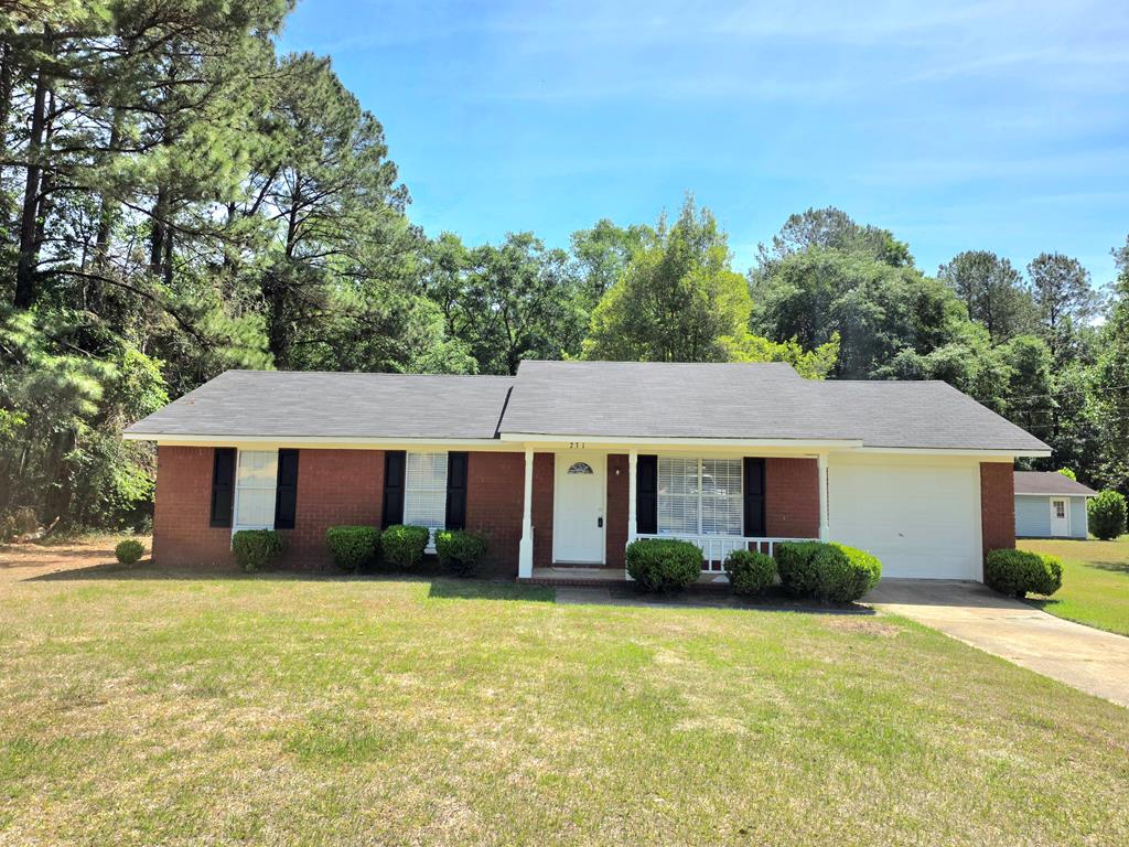 This charming three-bedroom brick residence offers the perfect blend of comfort and tranquility on a sprawling .75-acre lot. Brand-new flooring and freshly painted interiors throughout. The spacious layout includes a sun-drenched sunroom, where you can enjoy morning coffee or an evening read amidst natural light. Outdoors, discover serene living with fishing and boating privileges just moments away on foot or by bike, ideal for weekend adventures or leisurely afternoons by the water. A sizable garage provides plenty of storage for your vehicles or outdoor gear. Here, you'll find unparalleled privacy without sacrificing convenience—located close to local amenities yet offering a peaceful retreat from city life. Whether you're entertaining guests or seeking solace in nature's embrace, this delightful property is ready to welcome you home. Don't miss out on this unique opportunity; experience affordable country living and a great community just 10 minutes from schools, shopping and restaurants.