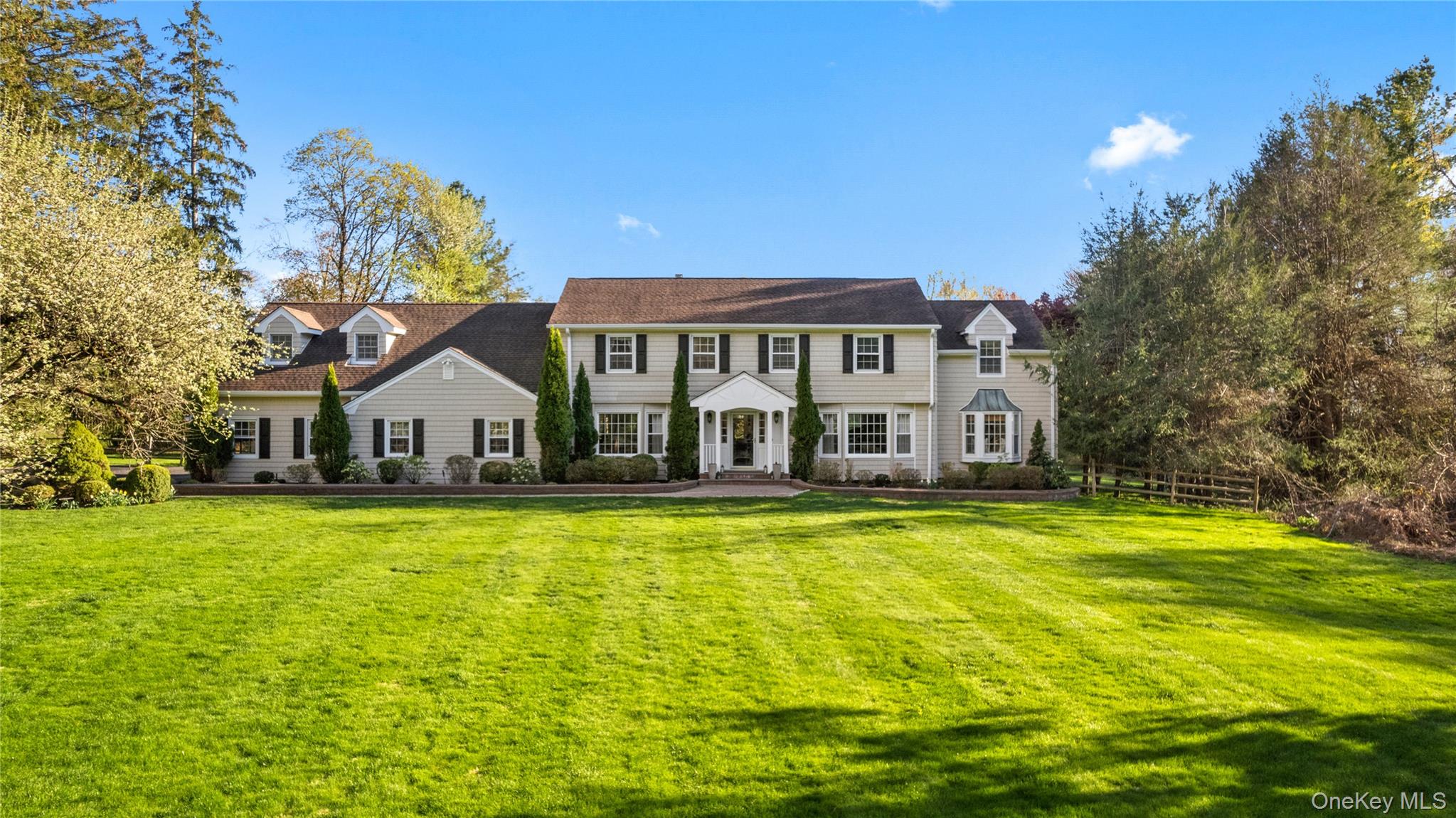 Set on over two acres of lush, level grounds, this magnificent traditional center hall Colonial offers over 4,100 square feet of inviting living space and a home that truly radiates warmth and happiness at every turn—all within minutes to town, major highways, and located in the highly sought-after Byram Hills School District.A gracious entry foyer welcomes you and flows seamlessly into an expansive living room and formal dining room—spaces where countless memorable meals and celebrations await. The beautifully updated eat-in kitchen features a large seating island, sunny breakfast area, and sliders that open to an expansive patio and sweeping backyard—perfect for seamless indoor-outdoor living. A thoughtfully placed mudroom with laundry sits just off the three-car garage for everyday ease. The first floor is completed by a comfortable family room with fireplace, a recently renovated powder room, a charming sitting room and sunny greenhouse.Upstairs, the oversized primary suite offers a serene retreat with a full bath and an exceptional versatile bonus/flex space—ideal for a home office, dressing room, nursery, or fitness area. Four additional bedrooms and two full bathrooms provide ample space for  guests. A rear staircase adds both charm and convenience, perfect for late-night kitchen snack runs.The lower level highlights a recreation space, wine storage, a room for hobbies or play and ample storage.This rare offering combining space, comfort, location, and timeless appeal—perfect for both everyday living and entertaining. Lovingly maintained and filled with years of laughter, celebrations, and cherished moments, this special home is ready for its next generation and the memories yet to be made.
