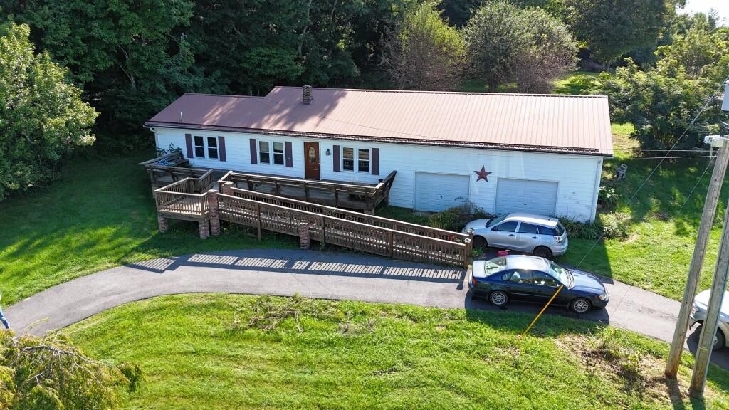 Enjoy peaceful country living in this neat double-wide home situated on approximately 1.2 acres. This property offers a comfortable 3-bedroom, 2-bath layout with plenty of outdoor space to enjoy the surrounding setting. Step outside and relax on the deck, gather with friends and family around the gazebo, or simply enjoy the privacy and tranquility of the countryside. The property also features a 2-car garage for parking, storage, or workspace. Additional highlights include a durable metal roof and a walk-in handicap-accessible tub, providing added convenience and accessibility. If you're looking for a home with room to spread out, outdoor living space, garage storage, and a peaceful country setting, this one is worth a look!