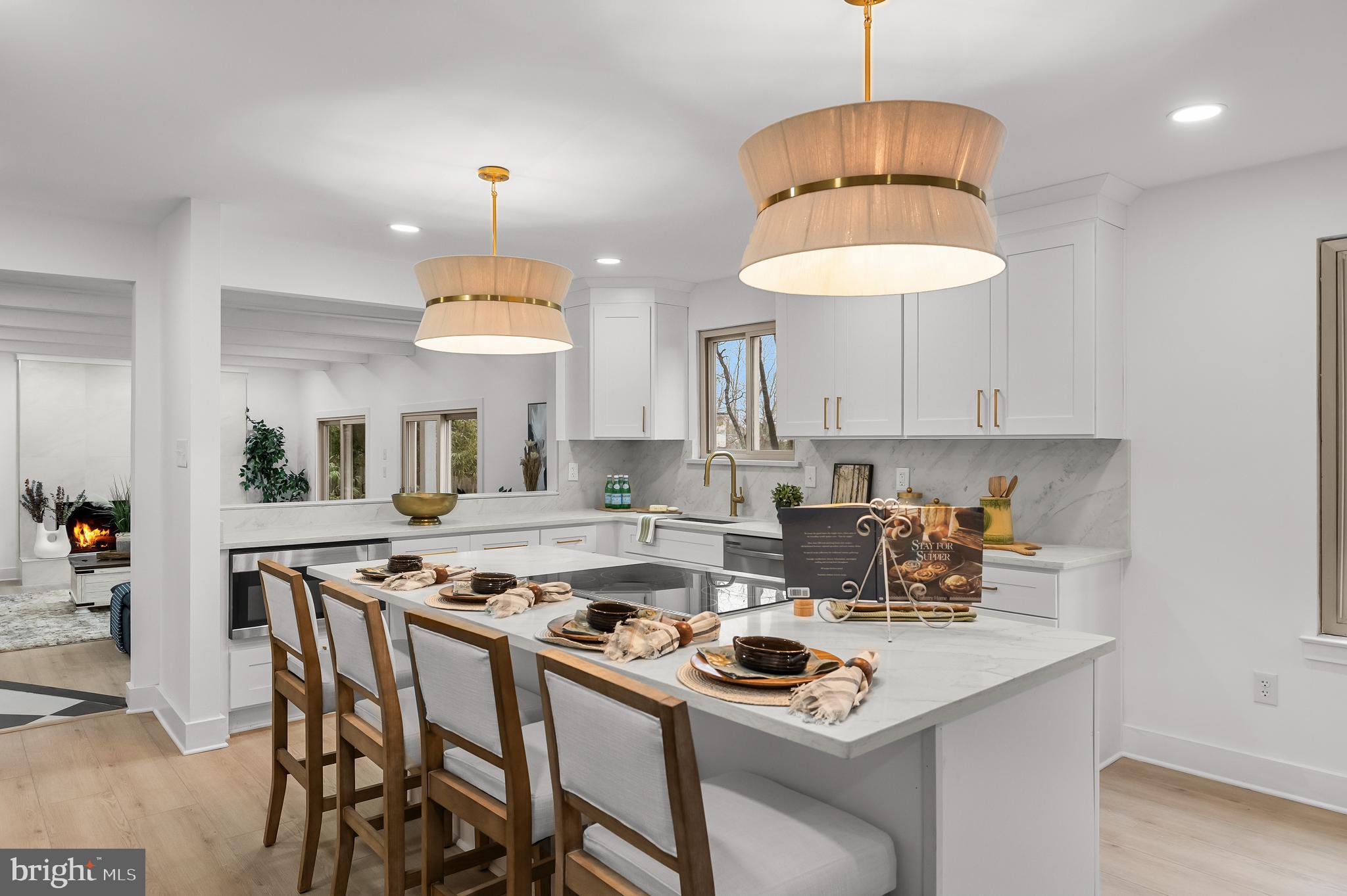 Welcome to 64 Chippenham Drive in the prestigious Alluvium community, a truly spectacular residence that redefines modern luxury living in Voorhees, New Jersey. Completely renovated and offering over 3,000 square feet of thoughtfully designed living space, this exceptional 4-bedroom, 2.5-bathroom home blends timeless architecture with sophisticated, high-end design and impeccable craftsmanship. From the moment you arrive, you are welcomed by a dramatic two-story foyer featuring striking black-and-white checkered tile flooring, elegant archways, and stunning architectural details that immediately set the tone for the designer finishes found throughout the home. The custom chef’s kitchen is nothing short of extraordinary and serves as the heart of the home. Designed for both everyday living and entertaining, it showcases upgraded custom cabinetry, quartz countertops, and a breathtaking oversized center island with gold accents, highlighted by gorgeous designer light fixtures above. Outfitted with stainless steel appliances, an induction stove, and a built-in wine refrigerator, this kitchen is truly a dream for culinary enthusiasts. The oversized island offers abundant storage while the elegant design and finishes feel straight out of a luxury design magazine. Freshly painted throughout with luxury vinyl plank flooring and all-new designer fixtures, the home is filled with natural light from walls of windows, creating a bright and inviting atmosphere. The spacious dining room is perfect for hosting memorable dinners and gatherings, while the beautiful living room offers plenty of room to relax and entertain. The stunning family room, adorned with exposed beams and a gorgeous fireplace, features sliding doors that open seamlessly to the backyard. Just off the main living space is a versatile bonus room that can serve as a sunroom, playroom, or relaxing retreat, offering additional flexibility to fit your lifestyle. The first floor also includes laundry and a beautifully updated half bathroom for added convenience. Upstairs, the primary suite is a true private sanctuary, featuring a cozy fireplace, private balcony, and a spacious walk-in closet. The spa-inspired ensuite bathroom feels like a Ritz-Carlton retreat, boasting a large 10-foot walk-in shower with double shower heads, a marble-topped double vanity with marble backsplash, and elegant designer finishes throughout. The second floor also offers three additional generously sized bedrooms along with a completely renovated hall bathroom that features two spacious vanities, ample storage, and sophisticated gold fixtures that add a contemporary touch. Step outside to your private outdoor oasis, where an in-ground pool and custom patio create the perfect setting for summer entertaining, relaxing weekends, and unforgettable gatherings. Surrounded by new vinyl fencing, the backyard offers both privacy and style, making it an ideal space to unwind, host guests, and enjoy outdoor living at its finest.  Completing the home is an oversized two-car garage, providing ample space for parking, storage, or a workshop. Every detail of 64 Chippenham Drive has been thoughtfully curated—from the custom finishes and designer lighting to the elegant architectural elements—making this home truly one of a kind. Located in one of Voorhees’ most sought-after communities, this exceptional residence perfectly combines luxury, comfort, and lifestyle living. Schedule your private tour today and experience this extraordinary home for yourself.