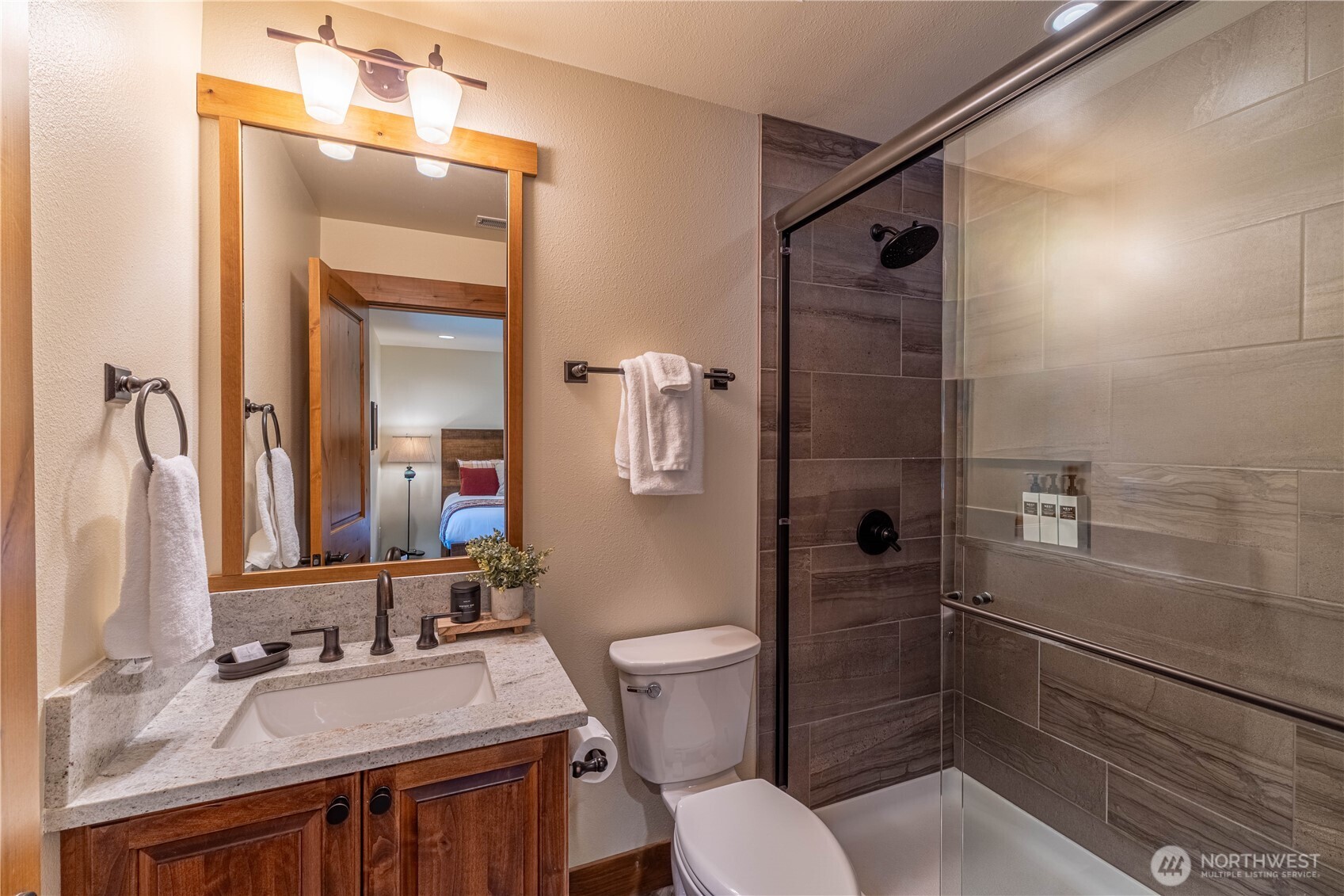 Well-appointed en suite bathroom featuring stylish design and quality finishes.