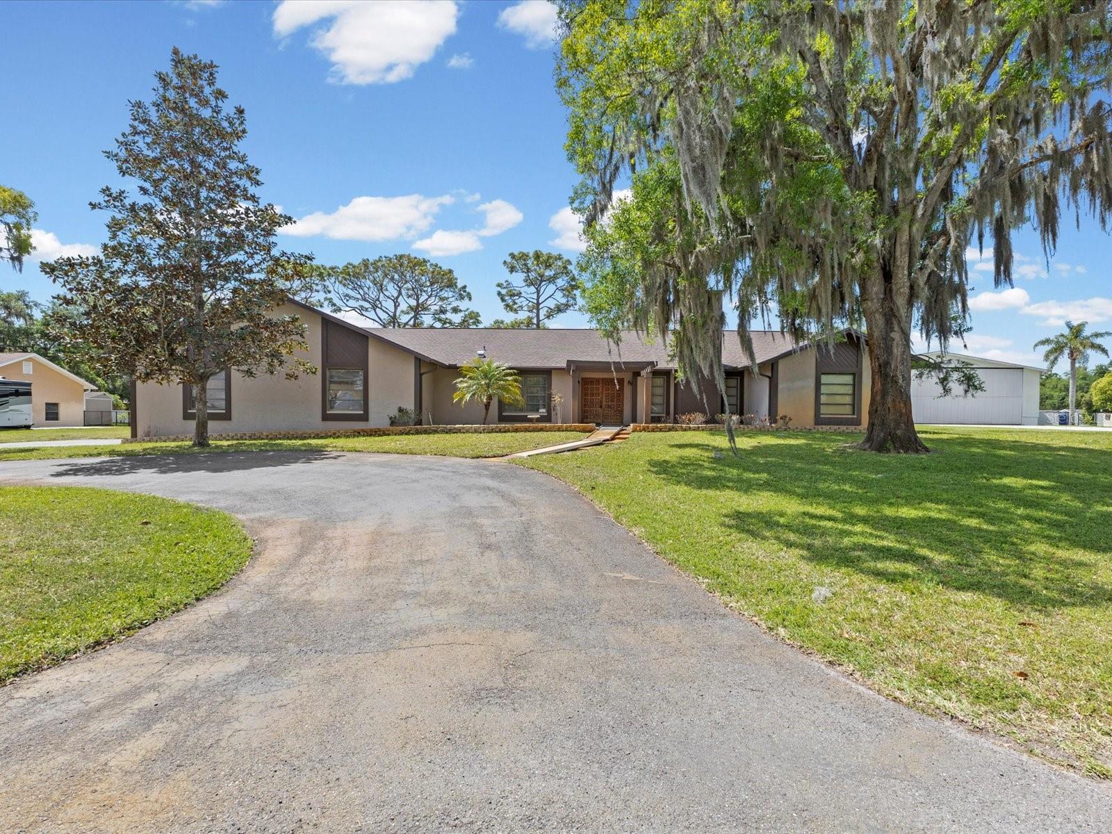 Welcome to aviation living at its finest in Hidden Lake Estates (FA40)—one of the Tampa Bay area’s most sought-after private airpark communities! No HOA, No CDD, No Flood Zone, Block Home, New roof in 2022. Situated on a 1 acre lot, this 3-bedroom, 3-bathroom home offers the perfect blend of comfort, functionality, and pilot-focused lifestyle. Step inside to find a spacious layout anchored by a large kitchen—ideal for entertaining or everyday living—with easy flow into the main living areas. Expansive pocket sliding glass doors open seamlessly to a covered patio, creating true indoor-outdoor living. The screened-in pool area features a deep in-ground swimming pool, allowing you to enjoy Florida living year-round while keeping the space comfortable and private. Beyond the pool, a huge backyard offers endless possibilities, including space for an additional hangar or expanded outdoor living. A standout feature of this property is the existing 44’ x 36’ hangar with a 40’ x 10’ door opening—perfect for aircraft storage, workshop space, or your next aviation upgrade. Located in the gated Hidden Lake Estates community, residents enjoy direct runway access, a private pilot lounge, and a vibrant aviation lifestyle. Runway 5/23 - 4425 feet long, 50 feet wide hard surface with lights and a dusk-to-dawn rotating beacon. The field elevation is 30 feet MSL. Runway 23 has a displaced threshold of 650 feet, leaving 3775 feet available for landing. A PAPI light system is present on the left side of the runway, approximately 700 feet beyond the threshold. Whether you’re taxiing from your home to the runway or relaxing poolside after a flight, this property delivers the best of both worlds. This is more than a home—it’s a runway-ready lifestyle.