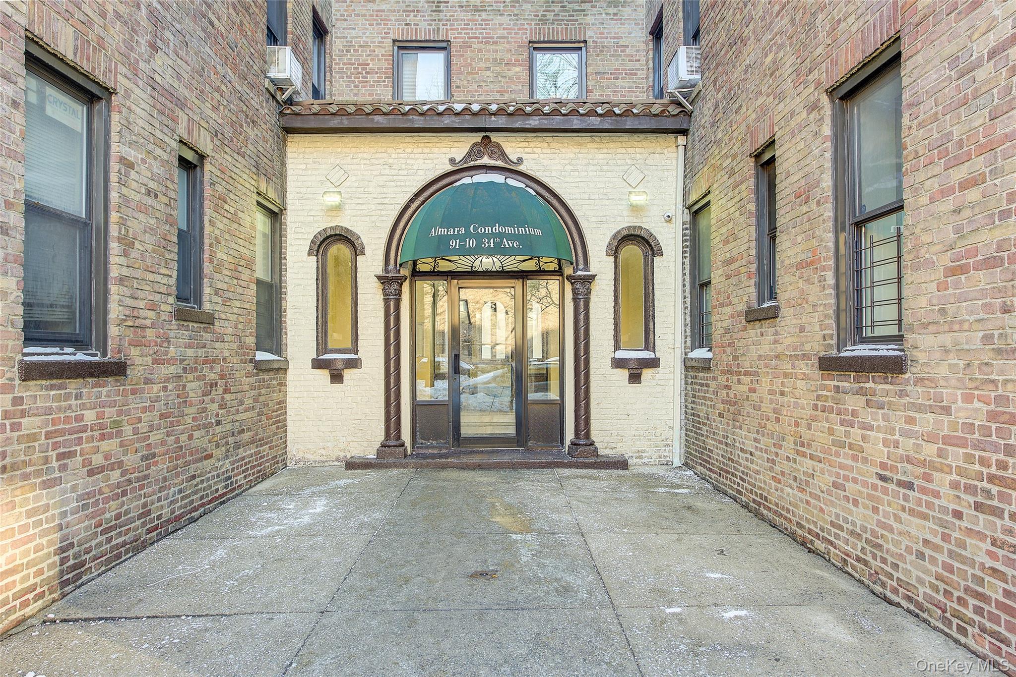 Elegant two-bedroom condominium blending classic prewar charm with modern updates, located in the heart of Jackson Heights. This home features an open floor plan that seamlessly connects the kitchen, dining area, and living room, creating a spacious and inviting layout ideal for both everyday living and entertaining. The renovated kitchen offers white cabinetry with brushed stainless-steel pulls, white granite countertops, full-size stainless-steel appliances, and a central island with a butcher-block top. Pendant lighting adds warmth and definition to the space. An oversized entry closet provides exceptional storage.The dining area comfortably accommodates both small and large gatherings, while the expansive living room easily fits a large sofa or sectional without compromising flow or openness. Both bedrooms are generously sized with ample closet space. The bathroom features a soaking tub, classic subway tile shower surround, and a pedestal sink. Additional highlights include hardwood floors throughout, high ceilings, northern exposure, and timeless prewar details.A refined and comfortable home offering space, character, and thoughtful updates in one of Jackson Heights’ most desirable settings. The Almara Condominium is conveniently located In Jackson Heights and near all types of public transportation, shopping, Travers Park, 34th Avenue Open Streets and the Jackson Heights Greenmarket on Sundays. Additional amenities include in-building storage (fee may apply), on-site laundry facilities, and resident superintendent. Property Tax Value must be verified by purchaser(s).