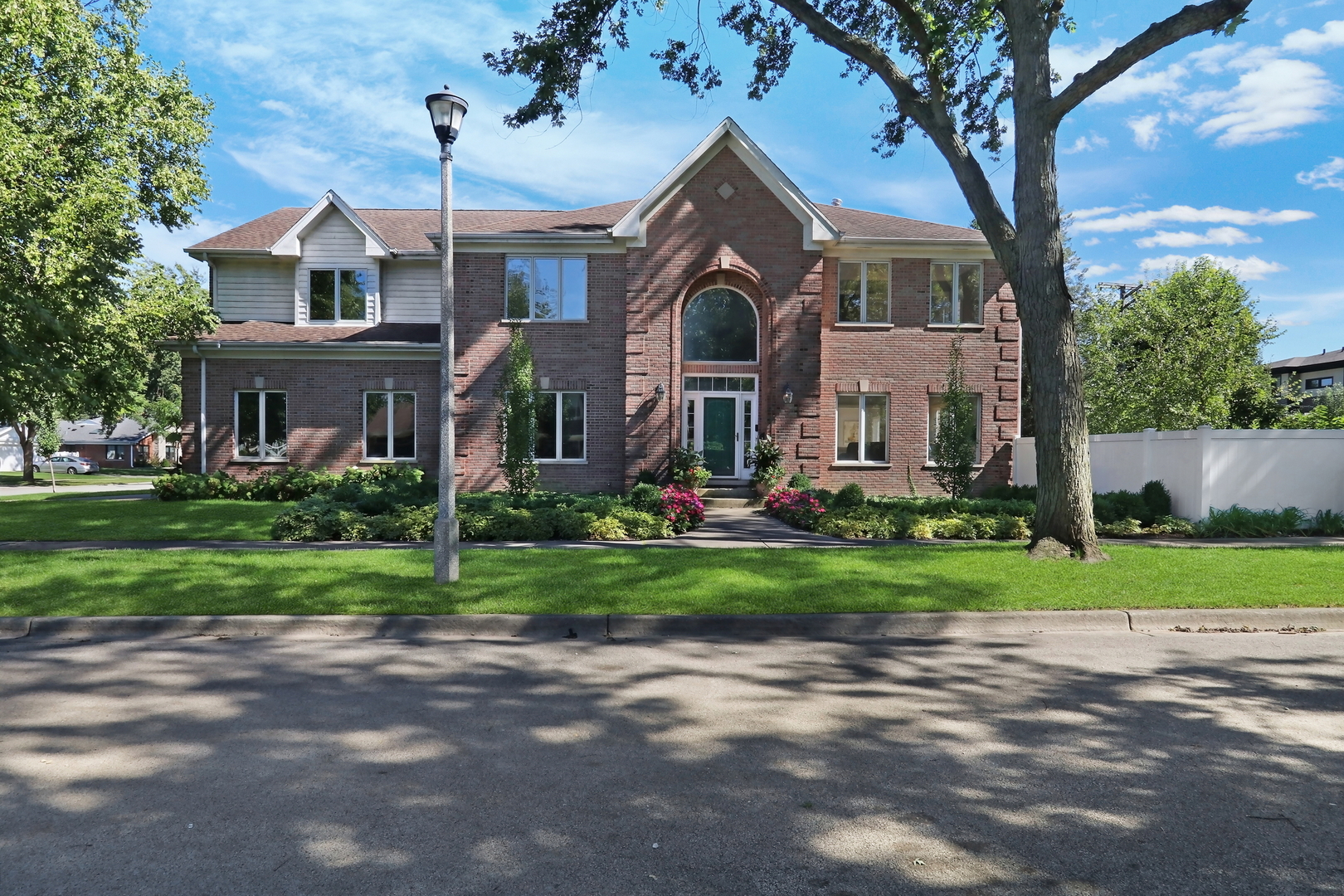 Your search ends here! Stunning curb appeal, exceptional outdoor living, and a remarkably spacious interior define this extensively updated brick home offering 7 bedrooms, 6.5 bathrooms, approximately 3,935 square feet above grade, plus a beautifully finished basement providing substantial additional living space. Professional landscaping and hardscape by Chalet enhance the home's striking exterior and create an impressive first impression. Step inside to an expansive, light-filled layout showcasing gleaming hardwood floors, generous room sizes, beautifully updated bathrooms, and architectural details throughout. At the heart of the home, the spacious kitchen is equally suited for everyday living and entertaining, featuring beautiful quartzite countertops, abundant cabinetry, a subway tile backsplash, large center island, stainless steel appliances, dedicated ice maker, large walk-in pantry, generous prep space, and ample table space for casual dining. The main level offers multiple living and entertaining spaces along with a convenient powder room and a private first-floor bedroom featuring its own beautifully updated ensuite bathroom with a luxurious walk-in shower, creating an ideal arrangement for guests or extended family. Adding to the home's thoughtful and functional layout are two separate laundry areas, with one conveniently located on the first floor and a second upstairs. The impressive primary suite is a true retreat, featuring a vaulted ceiling, separate sitting area, dual closets, and a spacious private ensuite bathroom. The upper level offers outstanding bedroom-to-bathroom access, including an additional bedroom with its own private full ensuite bathroom and two separate Jack-and-Jill bathrooms serving the remaining bedrooms. The beautifully finished basement significantly expands the home's living and entertaining space, featuring a dedicated media room with a wet bar and attached full bathroom, along with an oversized recreation area with plenty of room for entertaining, games, fitness, or additional everyday living. Ample basement storage adds even more functionality. Outside, the backyard is every bit as impressive as the interior. Surrounded by composite fencing, the professional Chalet landscaping and hardscape create an inviting outdoor setting. An expansive patio is built for entertaining with built-in grills, a gas fireplace, and multiple areas for dining, gathering, and relaxing. Even the attached 2-car garage has been thoughtfully finished with epoxy flooring and retractable overhead storage shelving. Additional highlights include a whole-house generator and a whole-home UniFi WiFi and exterior camera system wired to a central equipment rack with battery backup. Ideally located close to schools, parks, shopping, and dining, with convenient access to Metra and the Edens Expressway. Offering nearly 4,000 square feet above grade plus substantial finished basement living space, beautifully designed indoor and outdoor entertaining areas, and thoughtful updates throughout, this home delivers an impressive combination of space, comfort, functionality, and design. Floor plans in photos. Schedule a showing today.
