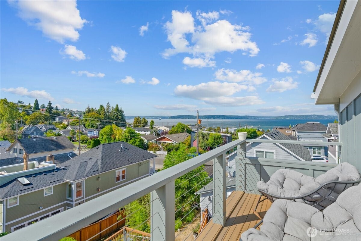 Where historic Old Town charm meets a show-stopping modern transformation! Extensively reimagined to capture breathtaking, unobstructed views of the Bay, mountains & city, this one-of-a-kind home was designed to make the scenery part of everyday living. Soaring 14-ft ceilings, strategically placed windows & abundant natural light create an unforgettable main level, anchored by a chef-inspired kitchen featuring custom cabinetry, stone counters, designer lighting & exposed original brick—a beautiful nod to the home's historic character. Upstairs, the newly added primary suite is a private sanctuary with skylights, a spa-inspired bath & its own Trex deck showcasing truly spectacular panoramic views—the ultimate front-row seat for sunsets, city lights & festive fireworks over the water! A 2nd bedroom, 2 baths & clever under-stair office nook add function without sacrificing style. Step outside to the expansive cedar deck, plumbed for gas & perfectly positioned for entertaining, BBQs or pizza nights while overlooking the lovingly tended gardens bursting with flowers & vegetables. Downstairs, the unfinished basement offers tall ceilings, bathroom plumbing & incredible potential for additional bedrooms, entertainment space or a future attached ADU. Thoughtfully updated while preserving the character that makes Old Town so special, w/ a newer roof & furnace, A/C added during the extensive 2023 remodel & EV charging. A rare opportunity where luxury, history & views come together.