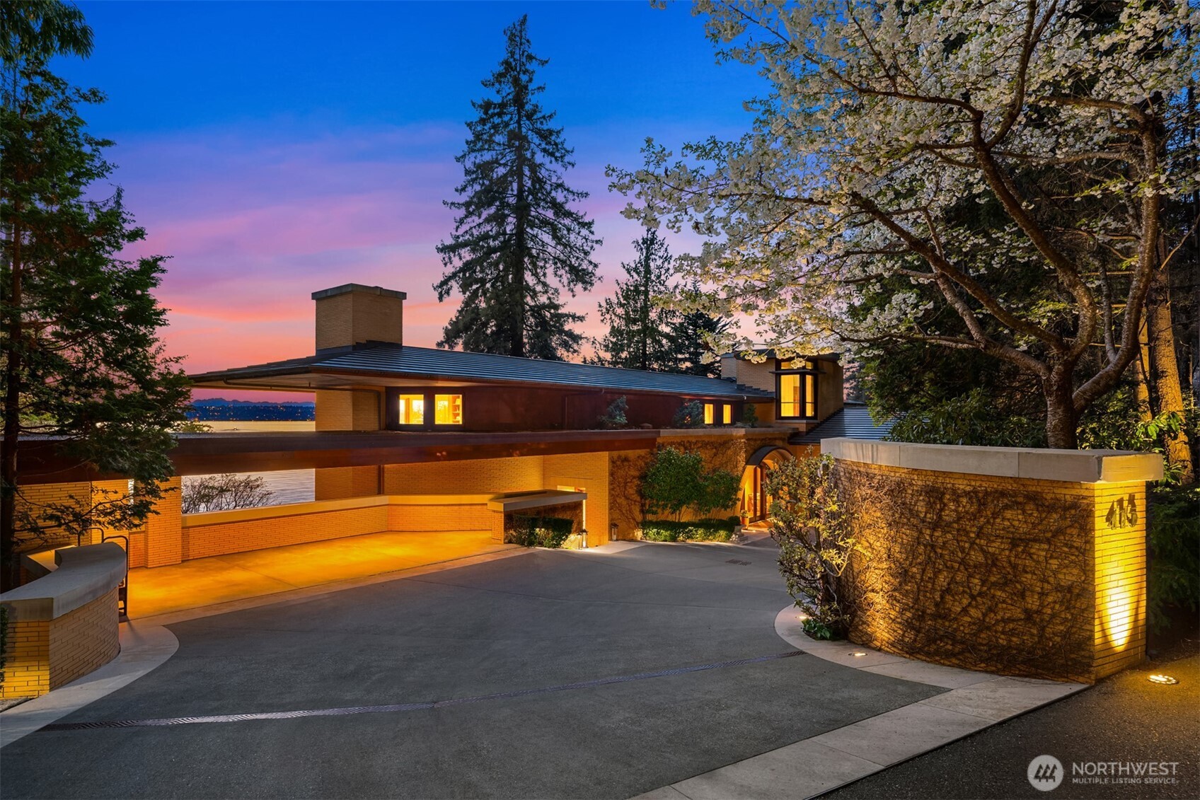 Discover unparalleled luxury in this Tom Kundig designed masterpiece. Echoing Frank Lloyd Wright's spirit, its exterior melds brick, mahogany, limestone, and copper. Inside, find Art Deco elegance with book-matched Honduran mahogany walls and elegant African mahogany floors throughout. This unique marriage of materials radiates warmth, sophistication, and timeless appeal throughout the residence. Set on nearly 2 acres, enjoy 135ft of prime waterfront, with due west - facing, breathtaking views. The unique intersection of traditional and modern design encapsulates the essence of true architectural innovation, reflecting a profound respect for natural materials and their inherent beauty. It's more than a home, it's a timeless legacy.