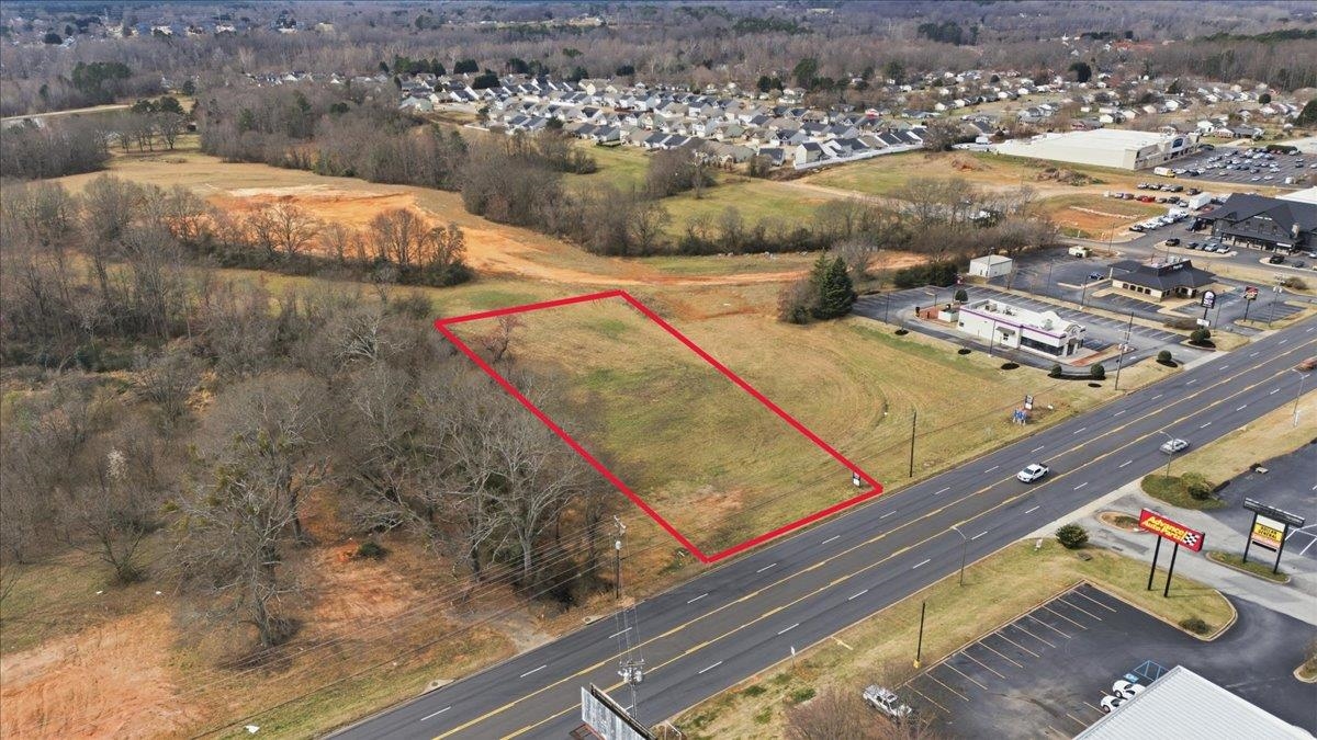 1.27 acres of commercial land centrally located in growing Inman, SC on Asheville Hwy (US 176). Featuring just over 200’ of road frontage, this site offers excellent visibility and accessibility. Seller has engineered plans on file. Surrounded by upcoming commercial development with new residential growth directly behind the property. This property is well-suited for retail, office, or service-based uses.