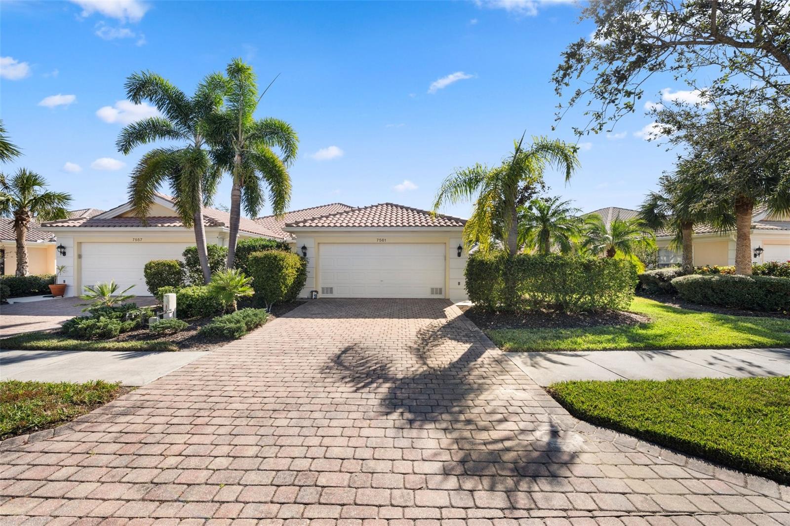 Under contract-accepting backup offers. Welcome to VillageWalk, a premier gated community in Sarasota! This charming Capri III villa offers comfort and convenience with a spacious great room featuring vaulted ceilings, a built-in wall unit, and carpeted floors. The open kitchen includes ample storage, a closet pantry, and a functional layout. The primary bedroom boasts a walk-in closet with built-in organizers and an en-suite bathroom with dual sinks and a walk-in shower. The guest bedroom offers its own bathroom and walk-in closet for added privacy. Additional features include a turnkey-furnished home, central vacuum, attic storage, security system, and a well-equipped laundry room with storage and a utility sink. Built by DiVosta with reinforced poured concrete, this villa is designed for durability. Enjoy the private screened lanai overlooking a peaceful, tropical backyard. Recent updates include new accordion shutters and a 2023 hot water heater. VillageWalk offers over five hundred acres of beautifully landscaped grounds and fantastic amenities like a clubhouse with a fitness center, on-site restaurant and bar, and a range of activities like tennis, pickleball, bocce ball, and two geothermally heated pools. The community also features a salon, boutique shopping, and even a gas station. Conveniently located near Siesta Key Beach, the Legacy Bike Trail, and great shopping and dining, this villa is the ideal retreat for enjoying the Sarasota lifestyle.