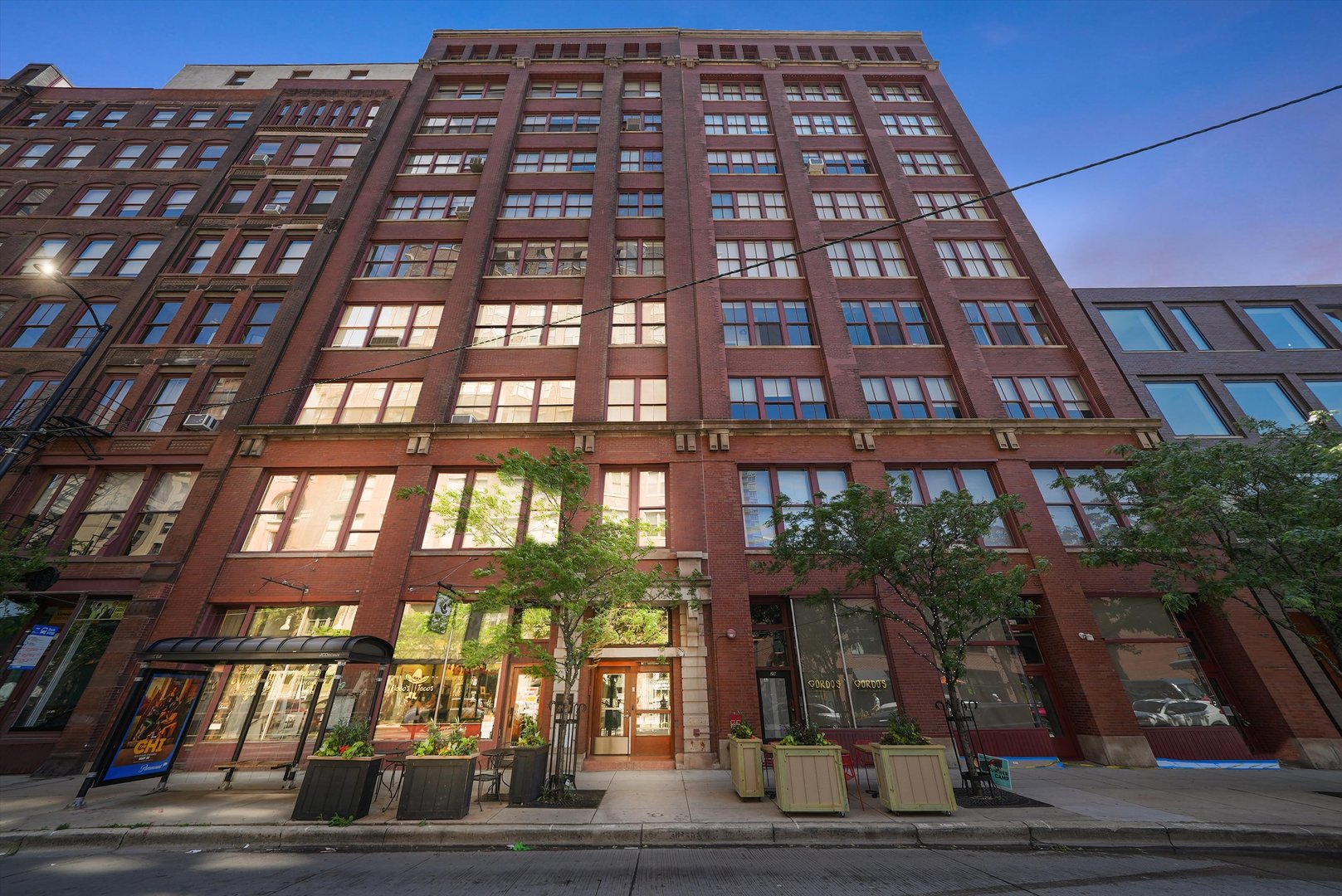 Few people get to say they live in an iconic home designed by legendary architect Harry Weese, a visionary of his time, and the first to convert industrial buildings into lofts.  The Donohue Building is Situated in Printers' Row, and here you have an entertainer's dream.  Almost 3000 sq feet stretching from Dearborn to Plymouth, open concept living, with sprawling 10+ ft ceilings, 7 ft windows with window seating and views that will never disappoint.  The chef in you can delight in the massive kitchen, the heart of the home, timeless with all the modern day amenities and comforts; double ovens, dishwasher and disposal.  The entertainment room has a beautiful terrazzo floor with curved ceiling ideal for movie nights, ballroom dancing, or a library for all your Printer's Row Lit Fest finds.  In addition to the original birdcage elevator, one of the oldest in the city and a joy to ride, you also have a private access freight elevator for easy move in, and garbage pickup.  The massive two feet of reinforced concrete once housed a massive printing press that ran classics like The Wizard of Oz. It was built to last-and Harry preserved that strength, turning it into something extraordinary.  The Donohue stands proudly beside a cafe that could've been Gatsby's second home, a bar where jazz and wine flow and a bookstore that keeps time with the past.  Every Saturday the block transforms into a community festival; free, local and full of life.  This isn't just a place to live.  It's a story worth telling.