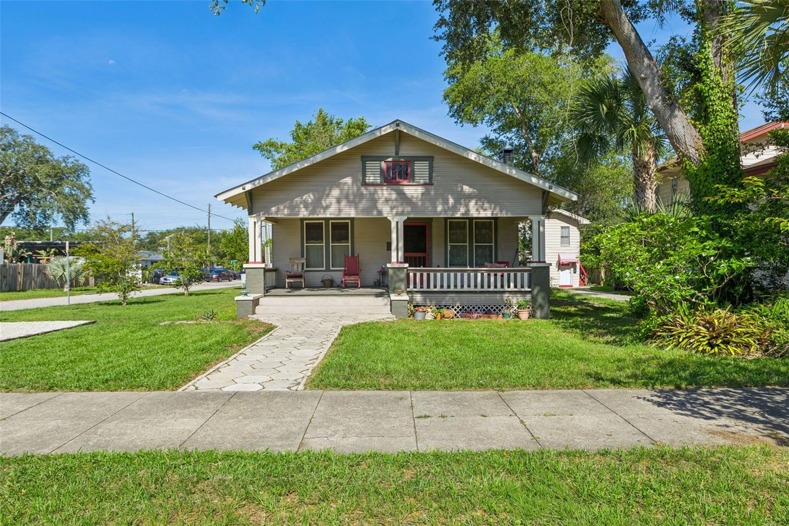Historic Charm in the Heart of Seminole HeightsThis beautifully restored historic bungalow, located in the Old Seminole Heights Local and National Historic District, seamlessly blends original craftsmanship with thoughtful modern updates. Original longleaf heart pine floors, preserved plaster walls, a restored fireplace, built-in serving pantry, and room-length window seat showcase the home’s timeless character.The updated kitchen honors the home’s history with a restored 1929 Magic Chef gas range, custom wood cabinetry, and period-inspired finishes, while modern systems provide peace of mind. Major improvements include a Galvalume standing-seam metal roof, updated electrical and plumbing, replaced sewer line, HVAC (2022), mini-split system, restored natural gas service, new fencing (2024), and a newly installed parking pad.Enjoy relaxing on the historically restored front porch or exploring all that Seminole Heights has to offer. Just minutes from popular restaurants, breweries, coffee shops, and neighborhood parks, this home offers the perfect combination of historic charm, modern convenience, and walkable urban living.