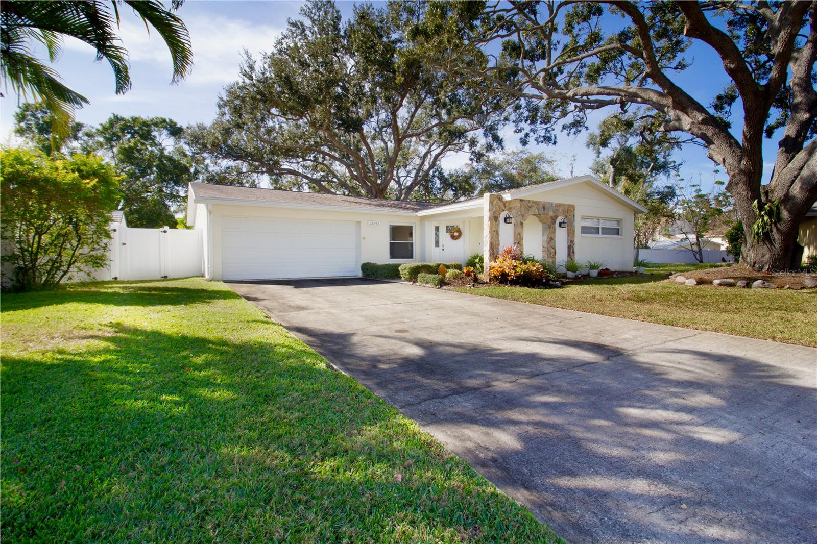 One or more photo(s) has been virtually staged. Welcome home to this beautifully updated 3-bedroom, 2-bath gem, peacefully tucked away at the end of a quiet cul-de-sac, just minutes from the sugar-sand Gulf beaches and the tranquil trails of Walsingham Park.Sitting on an expansive 0.29-acre lot with a fully fenced backyard, this home offers the perfect blend of privacy, space, and Florida charm. Step inside to a bright, open layout filled with natural light, ideal for both everyday living and entertaining. The spacious yard is equipped with an irrigation system and ready for weekend barbecues, playtime with kids or pets, and creating lifelong memories under the stars.Move-in ready with major updates already done for you:Brand-new 2025 HVAC systemBrand-new 2025 water heaterModern kitchen appliances installed in 2023Roof replaced in 2018Whether you’re looking for your forever home, a vacation retreat, or a smart investment in one of Florida’s most desirable areas, this property checks every box. Enjoy the laid-back coastal lifestyle with world-class beaches, parks, shopping, and dining just moments away.Don’t miss your chance to own this turn-key slice of paradise, schedule your private showing today!