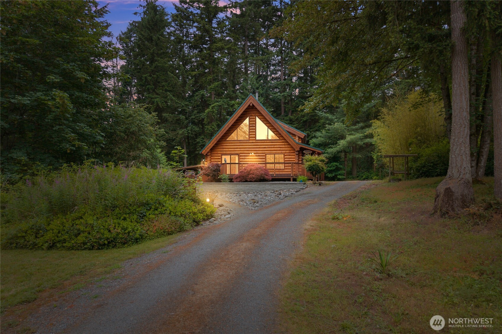 Log home • 1.25 acres • Large shop • Furnished option Experience the warmth and character of authentic Northwest living in this beautifully maintained 1,725 sq ft log home nestled on 1.25 private, wooded acres bordering the Graham/Eatonville area. Enjoy the peace and privacy of a forested setting while being just 10 minutes from Graham's shopping, dining, and everyday conveniences. Inside, you'll find 2 bedrooms, 2 baths, and a dramatic 25-foot vaulted ceiling that fills the great room with natural light and showcases the craftsmanship of the log construction. The spacious primary suite features a jetted soaking tub, creating the perfect place to unwind. Open living and dining areas provide an inviting layout for entertaining or quiet evenings at home. The property includes a large 864 square ft. shop, a woodshed, and abundant parking for RVs, boats, trailers, and recreational equipment. As a bonus, the home may be purchased fully furnished, including quality log furniture and cabin décor, offering a truly turnkey cabin experience. Surrounded by towering evergreens, this property delivers the feel of a mountain retreat while remaining conveniently close to amenities. You'll also enjoy easy access to Eatonville, Alder Lake, the Nisqually River, and Mt. Rainier National Park, placing hiking, fishing, boating, and year-round outdoor recreation just minutes away. A rare opportunity to own a timeless log home that perfectly balances privacy, convenience, and Northwest charm.