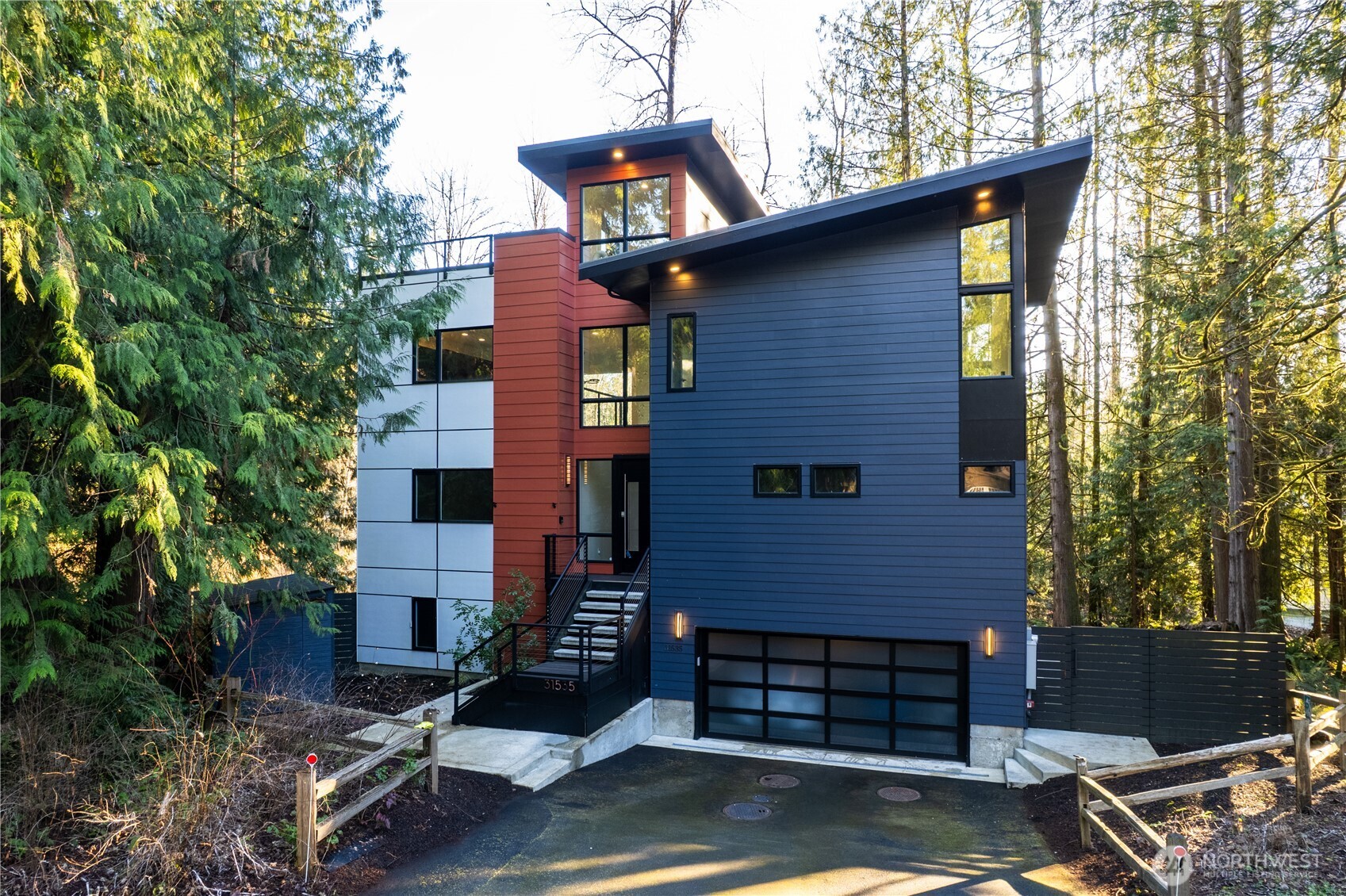 One-of-a kind, custom waterfront home on Lake Marcel. Thoughtfully designed with refined finishes and designer details throughout. The vaulted great room and gourmet kitchen span an entire level, creating an impressive space perfect for entertaining on any scale.The luxurious primary suite offers a spa-inspired bath with dual-entry shower, radiant heated floors, and a towel warmer. The primary bedroom, second bedroom, and office/optional third bedroom are all conveniently located on the main level.Designed for multigenerational living, the lower-level guest suite features a private deck and kitchenette — ideal for extended stays or separate living quarters.Equipped with modern and energy-efficient systems including multi-zone mini-split heating and A/C, plus tankless hot water heater. House also features Sonos sound system, Lutron smart lighting system with integrated dimmers, EV charger and generator. Enjoy 54 feet of private waterfront, accessed by a path leading to the water’s edge with a dock. Additional lake access is available through the Community Club beach and park.