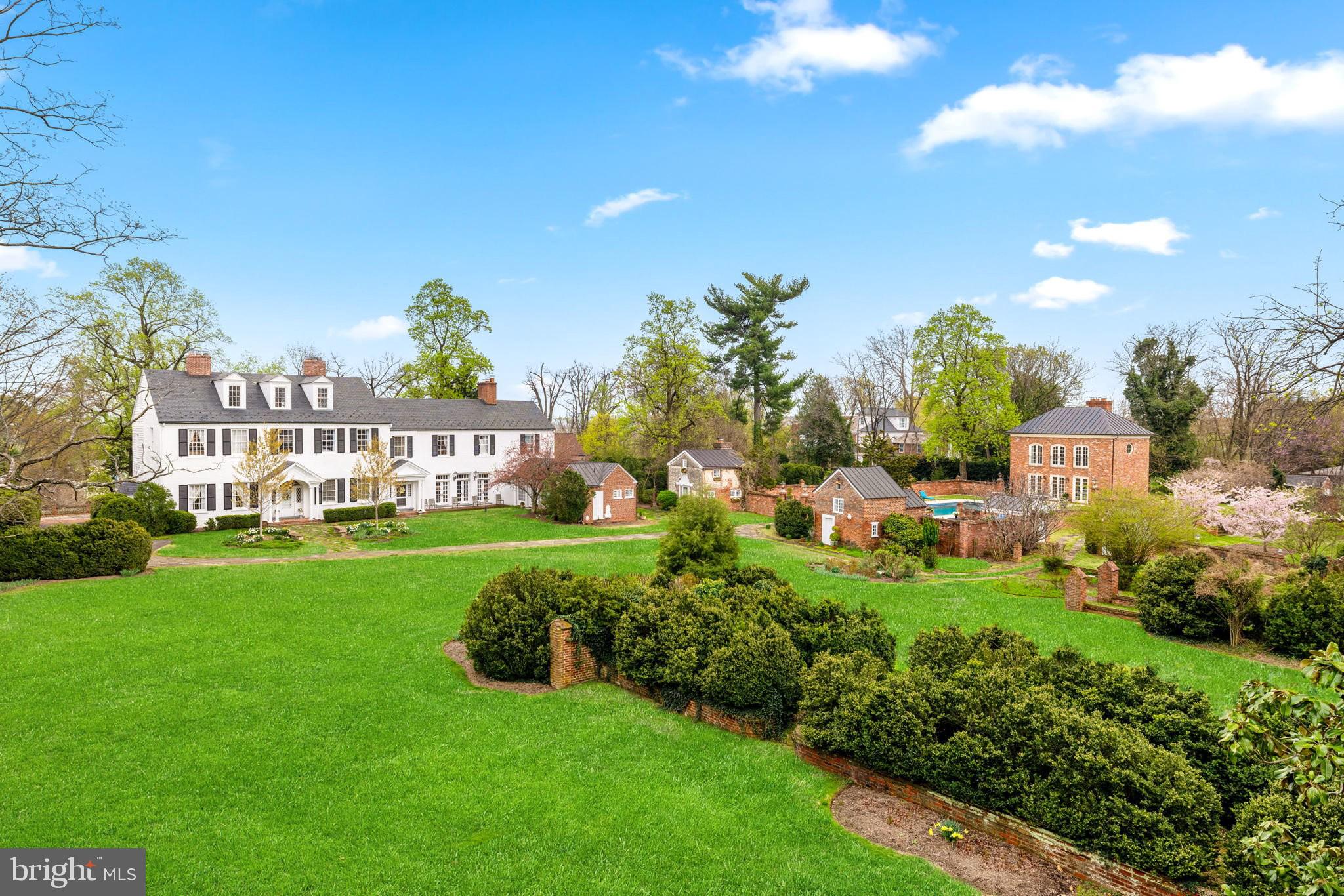 Ideally located in the heart of Alexandria City, Clarens Estate is a one-of-a-kind historic treasure that offers a rare opportunity to own a piece of American legacy. Originally built in 1803, this grand Colonial sits on nearly four acres of exquisitely landscaped grounds with views of the Potomac River.  Pre-construction, the land was reputed to have been the site of George Washington’s hunting lodge chosen for its commanding views and central location. Over the centuries, Clarens has played a pivotal role in American history—serving as a school, a hospital during the Civil War, and hosting some of the nation’s most prominent figures. Lovingly restored and modernized, Clarens is a serene retreat. A Storied Past: Steeped in rich history, Clarens was once the residence of James Murray Mason, a U.S. Senator and grandson of Founding Father George Mason. Mason acquired the estate in 1869, and the home became a gathering place for important historical figures, including Robert E. Lee and Jefferson Davis, who met there in 1870 for their final meeting. The estate also housed the prestigious Fairfax School, attended by notable figures George Washington Custis Lee and George M. Dallas. Later, the estate transitioned into a girls’ school and eventually became privately owned. Expansive and Elegant Grounds: Set on nearly four acres, the estate grounds are a private oasis. Mature Tulip Poplars, American Elms, Maples, Apple & Cherry Trees, Hydrangeas, Boxwoods, Tea Roses, and Antique Peonies (some transplanted from Dumbarton Oaks) surround the home and add to the magical atmosphere. An irrigation system helps maintain the lush landscaping. Historic brick walls and winding stone paths evoke the elegance of a bygone era. A picturesque pond with a brick footbridge, a loggia, and a palazzo contribute to the estate’s European feel. Four charming outbuildings—a one-bedroom carriage house with a wood-burning fireplace, a potting shed, an ice house, & a well house—all carefully preserved add utility and charm. The modern two story pool house, designed to blend in with the historic buildings, is the jewel of the property. Resort-Style Pool & Guesthouse: The heated 24'x44' pool includes a retractable cover, Jacuzzi, fire pit, and sandstone decking. A trellised BBQ area with a Wolf grill and granite countertops makes entertaining a delight. The pool house features a cozy living room with a fireplace, full kitchen and bath, and a spacious upstairs bedroom with estate views. Historic beams and wood flooring add charm, while French doors and natural light offer comfort and style.The Historic Main Residence: Spanning over 10,000 square feet, the main residence offers 7 bedrooms and 5.5 bathrooms, combining historical details with luxury living. Original hardwood floors, nine fireplaces, keystone arches, and elegant crown molding pay homage to the home’s heritage. Enter through a black-and-white marble porch with a Haint’s blue ceiling into a dramatic foyer flanked by a cozy library and a formal living room. The dining room is anchored by a Crystal Finials chandelier and hand-painted mural wallpaper. The French country kitchen features a La Cornue range, granite countertops, two farmhouse sinks, and top-tier appliances. A sunny family room opens via French doors onto the grounds, offering seamless indoor-outdoor living. The primary suite includes an 1806 Irish mantle, walk-in closets, and a luxurious bath with heated floors, a soaking tub, and a steam shower. Additional bedrooms provide ample space for family or guests, while the top-floor suite serves as a peaceful retreat or playroom.Located just 5 minutes from Old Town Alexandria and 15 minutes from Washington, D.C., Clarens offers both tranquility and urban accessibility. Though only moments away from premier dining, shopping, and cultural attractions, the estate remains a private sanctuary, untouched by the bustle of the city.See VAAX2045682 for development opportunity