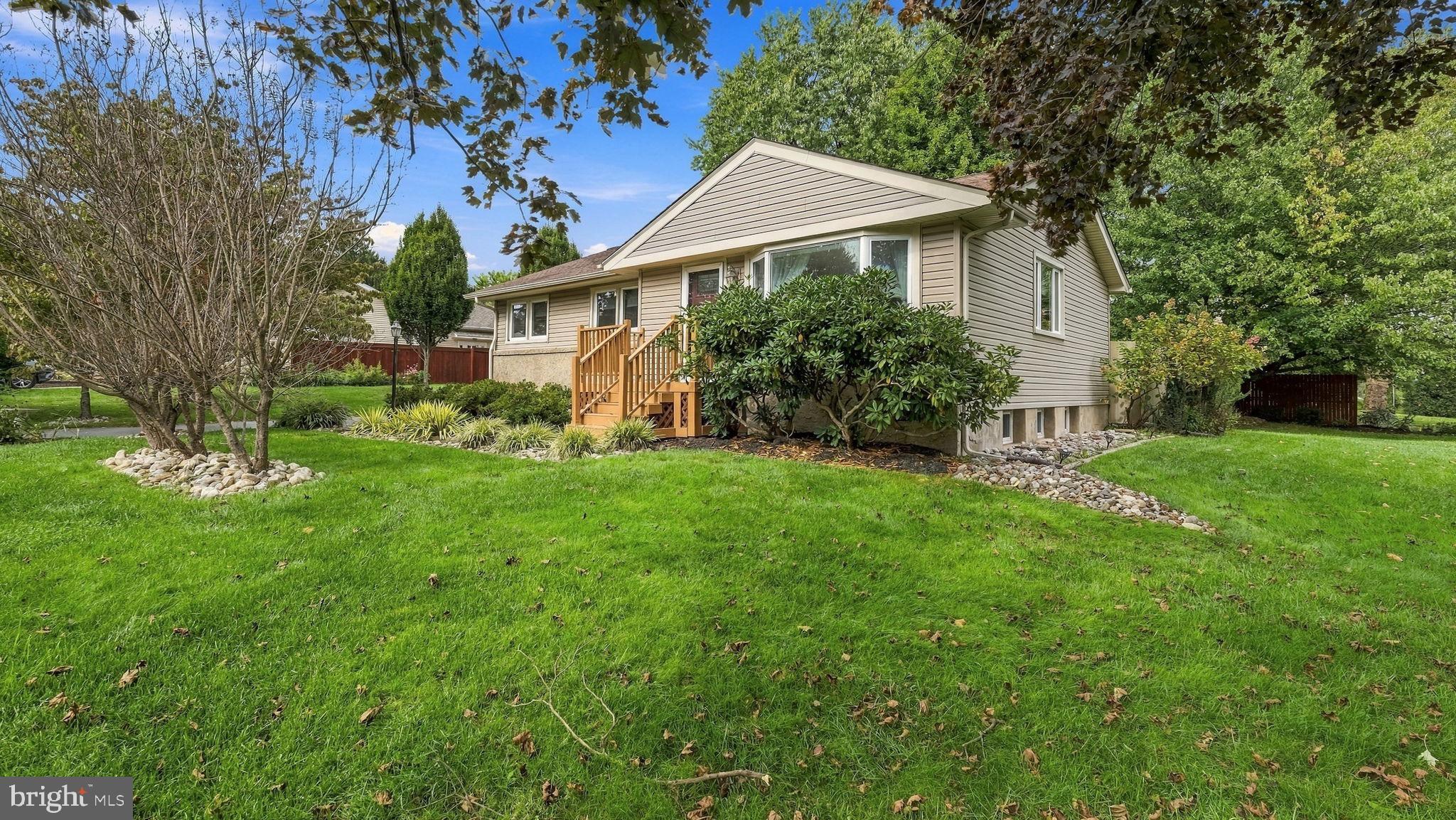Welcome to 91 Taifer Avenue! Situated on a desirable corner lot in Doylestown Borough, this well-maintained ranch-style home offers a convenient layout with thoughtful updates. Step through the front door into an open living area featuring new hardwood floors throughout the first floor. The living room flows into the dining area and kitchen, which offers ample cabinet space and stainless steel appliances. Three bedrooms and an updated hall bathroom are conveniently located on the main level. The partially finished basement provides additional living space with potential for a fourth bedroom, with LVP flooring, a full bathroom, and generously sized laundry room. An additional unfinished area offers plenty of storage and potential for even more finished living space. A detached one-car garage sits to the side of the home, surrounded by a large backyard. Conveniently located near downtown Doylestown, shopping, dining, parks, and more.