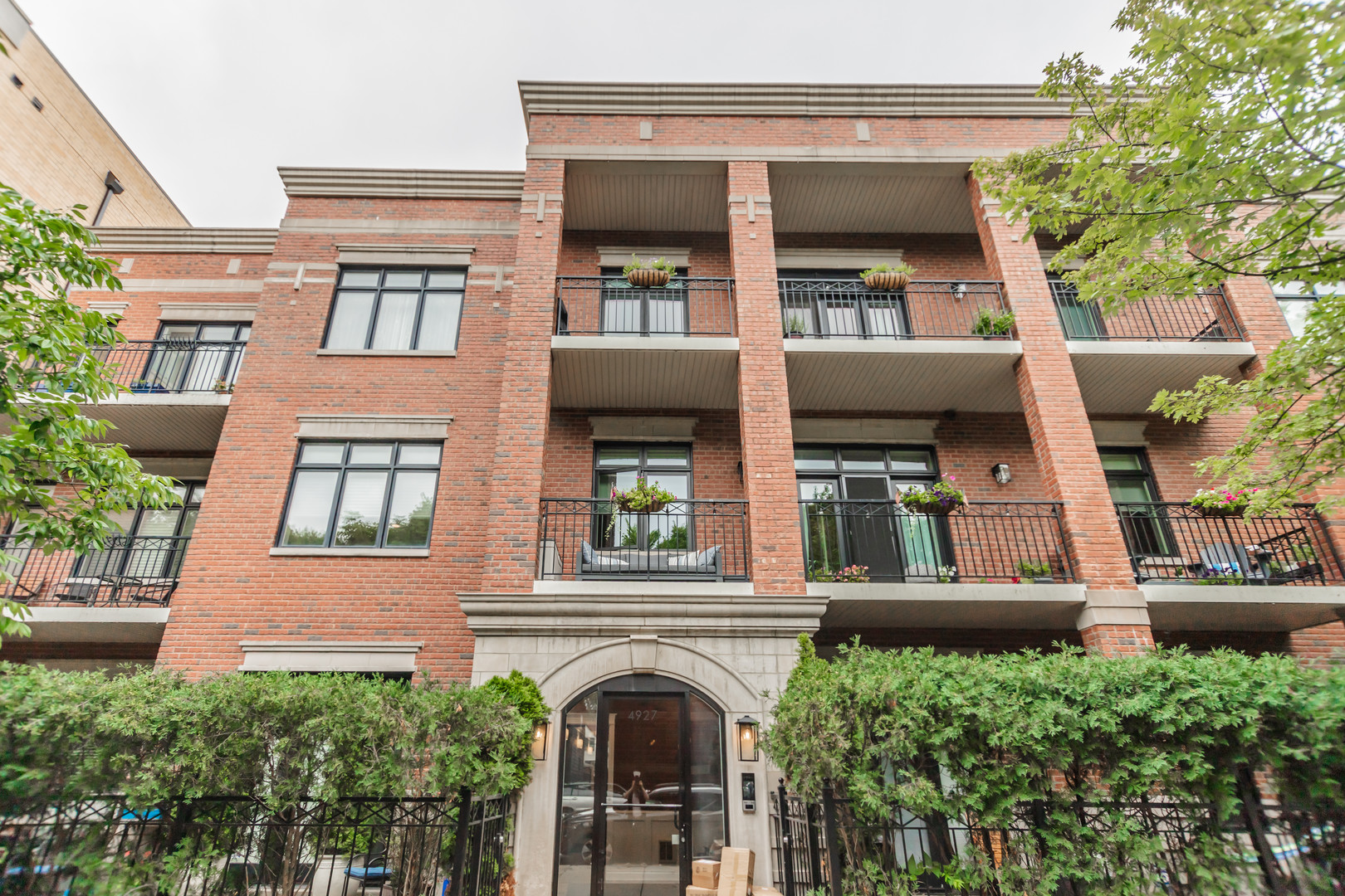 STUNNING 3 BED/2 BATH HOME IN BOUTIQUE ELEVATOR BUILDING - PRIME LINCOLN SQUARE/RAVENSWOOD LOCATION! This beautifully maintained, spacious and serene 3-bedroom, 2-bathroom residence offers the perfect blend of luxury, comfort and location. Set quietly back from the street with lovely views overlooking tree-lined Damen Avenue, this home features a wide, open floorplan accented by high ceilings, elegant crown molding and an abundance of natural light throughout. The open-concept kitchen and living area are ideal for entertaining, with stainless steel appliances, granite countertops and a generous breakfast bar. Relax by the cozy gas fireplace in the sunlit living room, complete with a built-in surround sound system. Just outside, a private covered front porch provides the perfect space for grilling or unwinding outdoors. The spacious primary suite is a true retreat, boasting a wall of windows, an oversized walk-in closet with custom organization, and a luxurious en-suite bath with double vanity, makeup station, whirlpool tub, and a separate steam shower. Two additional bedrooms share a well-appointed hall bath, offering flexibility for guest space, home office, or both. A dedicated laundry room with side-by-side washer and dryer adds extra convenience. This home also includes TWO parking spaces (one in a detached garage and another in a covered carport), plus a large storage locker-all included in the price. The professionally managed building offers healthy reserves and is both pet and rental friendly. Unbeatable location - just steps from beautiful Winnemac Park, and walking distance to the Brown Line "L", Ravenswood Metra, Mariano's, local coffee shops, restaurants, and everything Lincoln Square and Ravenswood have to offer. WELCOME HOME!
