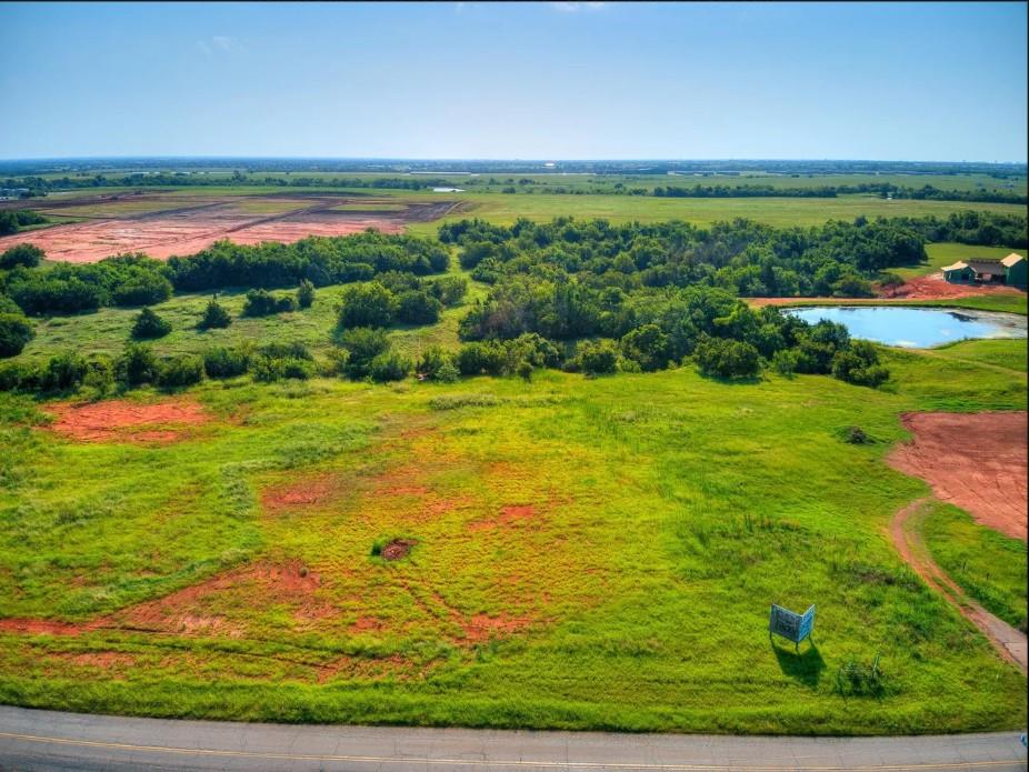 A rare opportunity to own over two acres with sweeping views that stretch for miles. This beautiful homesite backs to a wooded greenbelt, offering privacy and a peaceful natural backdrop, while still capturing distant views of downtown OKC. The elevated setting provides incredible sightlines and stunning sunsets. Enjoy quick, convenient access to all areas of the Metro while still feeling tucked away. Shared common space with only six neighboring properties creates a unique balance of open land, privacy, and community—an ideal setting for your dream home. - City water, city sewer is possible, but Aerobic Septic is option. Natural Gas.