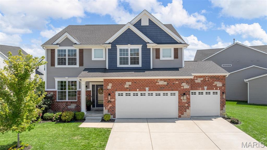 STUNNING 4BR 2.5BTH 2 sty in the desirable Villages at Shady Creek! This gorgeous home shows like a display & is loaded w/upgrades throughout. From the moment you step inside you'll be impressed by the HW floors, 9' ceilings & elegant finishes. Right off the entry french doors open to the den w/custom millwork ideal for a home office or study. Just beyond you'll find the elegant dining rm. The spacious great rm w/a cozy FP flanked by windows that fill the space w/natural light. The beautiful kitchen is a chef's dream featuring granite countertops, center island with bkft bar, 42" cabinets, farmhouse sink, marble backlash, SS appliances, TWO pantries,  bkft rm & just off the kitchen is the mudroom w/built in storage. Upstairs a loft provides flexible space for 2nd living area. The luxurious primary suite includes a walk-in closet & spa like bath w/dbl sink vanity & HUGE shower. 3 add'l BR, 2nd full BTH & laundry rm complete the upper lvl. The LL w/egress window & rough in for BTH offers tons of potential for added living space. Step outside to the backyard oasis where a spacious patio features a custom outdoor stone FP perfect for entertaining or relaxing year-round. All of this located in the sought after Villages at Shady Creek offering a pool w/lazy river, playground, basketball & volleyball courts, scenic walking trails & peaceful ponds. The one has it all: style, space, unbeatable amenities & within the Wentzville School District. Don't miss the chance to make it yours.