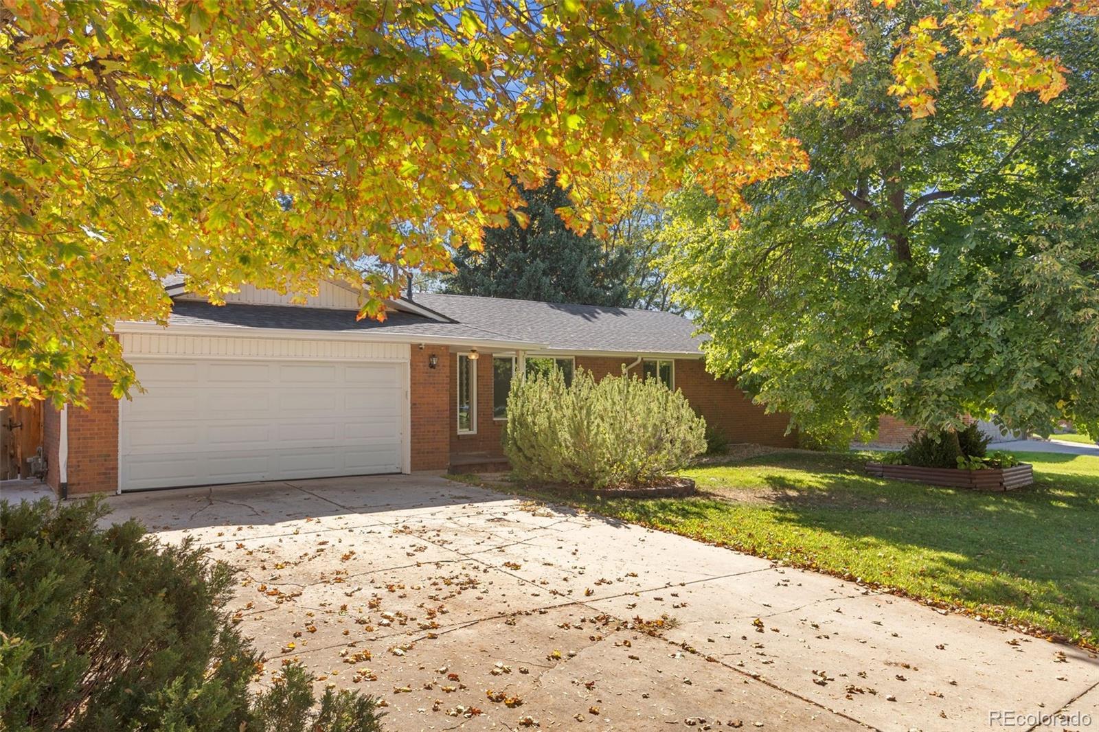 Rarely does a property offer this kind of dual perspective magic: a beautiful mountain view framed between mature trees in your private backyard and the lush greenery of a sprawling park and elementary school directly out your front door. A striking view of Longs Peak from the driveway adds to the incredible setting. Situated in the heart of coveted Longmont Estates, 99 Baylor Drive is a standout opportunity to capture a lifestyle defined by nature and convenience, just moments from the scenic trails of McIntosh Lake.Inside, the home radiates a bright, high energy feel. Warm wood floors lead you into a crisp white kitchen, where a large peninsula serves as the social hub of the main level. The living space is anchored by a classic brick fireplace and custom built ins, flowing effortlessly into a sun drenched sunroom that opens directly to the backyard. With six spacious bedrooms, three on the main level and three in the finished basement, three baths, and a massive recreation room, the footprint here is exceptionally versatile.Outside, mature landscaping and a private patio create an inviting retreat for relaxing and entertaining. Across the street, the sprawling park offers expansive green space and tennis courts, with shopping, dining, and conveniences nearby.Beyond its exceptional setting and generous footprint, the home features significant improvements, including a 2024 Class 4 roof, newer HVAC system and ductwork, whole home air filtration system, and dedicated mini split for the sunroom. Newer wood floors enhance the main level, while an oversized garage adds valuable storage and workspace. Positioned within the highly regarded St. Vrain Valley School District, this is a chance to secure a significant piece of real estate in one of Longmont’s most established and desirable locations. Opportunities to own a setting like this, with a park as your front yard, are few and far between. Bring your vision and claim this retreat today!
