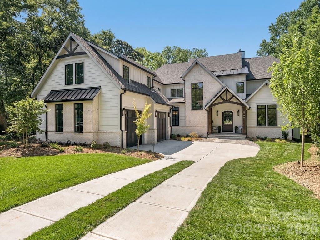 This exceptional new two-story custom home blends contemporary design with timeless warmth on one of Charlotte's most desirable locations on a beautiful tree lined street in Sedgefield.  Designed with both luxury and livability in mind, the home features expansive open-concept living spaces, curated designer finishes, and beautiful white oak accents throughout.  At the heart of the home is a chef's kitchen with high end appliances and custom cabinetry that flows seamlessly into the eat-in breakfast nook and light filled living space.  Large sliders lead to a covered rear porch with a gas fireplace, creating an effortless connection between indoor and outdoor living.  The thoughtfully designed floor plan includes five bedrooms, five and a half bathrooms, a private office, loft, and bed/bonus room.  The spacious primary suite offers a spa-inspired retreat with stunning tilework, a coffee nook, closet laundry connections, and elevated finishes. A well-appointed mudroom with built-ins and a desk/drop zone adds practical organization just off the oversized two car garage.  The home is very energy efficient - with foam insulation in the attic and a sealed, encapsulated crawl space with a dehumidifier.  It is just minutes away from uptown, several parks, and a plethora of restaurants!   The home is protected by a StructSure 1-2-10 Home Warranty to be passed to the buyer at closing.  Your next home awaits!