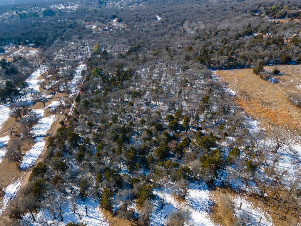 Escape the city without leaving it behind. This private, wooded 10+ acre property in southeast Norman offers the space and freedom to create your ideal lifestyle. Enjoy quick access to Lake Thunderbird for boating, fishing, and outdoor recreation, while still being just minutes from OU campus, shopping, and dining. Whether you’re building a custom home or placing a mobile home, this property is build-ready with existing well, septic system, and lateral lines in place, saving you time and money. OEC Fiber is also available. This is a rare opportunity for peaceful country living close to town!