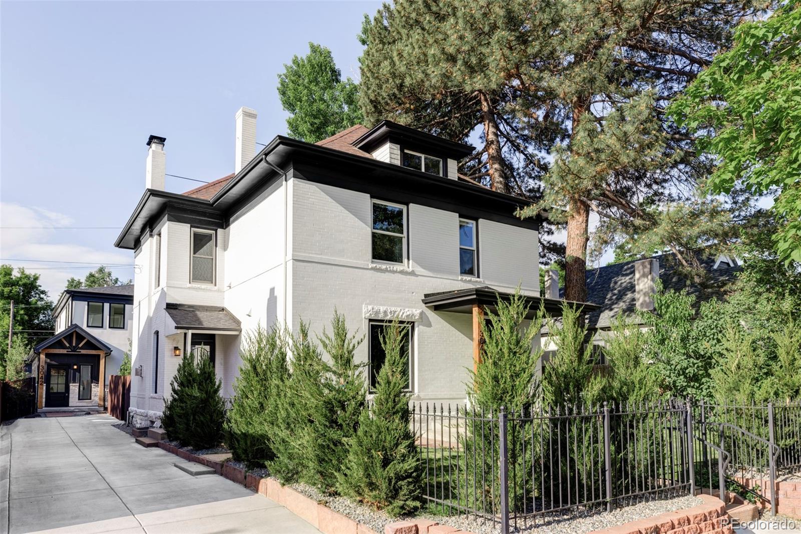 Fall in love with this fully remodeled Denver Square home in the heart of the sought-after Highlands neighborhood. This masterpiece contains the original wood-carved stair handrails, pocket doors with antique hardware, and fully restored red oak floors. Despite maintaining its classic features, this home has all the modern amenities. The main floor features a chef’s kitchen with a gorgeous island, SS appliances, pantry, and coffee/wine bar that flows into an open living room w/ a gas fireplace and adjoining dining room. The main floor also features a bathroom with marble tile, front foyer, and mudroom that flows out to the back patio – perfect for entertaining on those beautiful Denver summer evenings. This unique home has 3 levels above ground, with the second story featuring a laundry room with W/D, full bathroom w/ marble tile, two bedrooms, and a primary suite. The primary suite has been updated to include a custom walk-in closet, a stunning marble shower, and a double vanity. The third story features two storage spaces and two rooms, great for an office, gym, or kids playroom. Make your way to the LL and find a wet bar with beverage fridge, rec area, bathroom, bedroom, W/D hookup, and access to the back patio. This house is perfect for entertaining or hosting out-of-town family while offering plenty of privacy for guests. Additional features include a new tankless water heater and new furnace. An oversized two car garage is located at the back of the property, w/ plenty of additional street parking out front for guests. The landscaping features a juniper hedge surrounding the lush front yard w/ mature trees overhead. The back patio also features fast-growing aspen trees for privacy, all supplied by a brand new sprinkler system. This property is located just several blocks away from some of Denver’s best shops and restaurants in the Highlands; 5 min from downtown Denver; 4 min to Mile High Stadium and Ball Arena; and 3 min from Sloan Lake and Jefferson Park.
