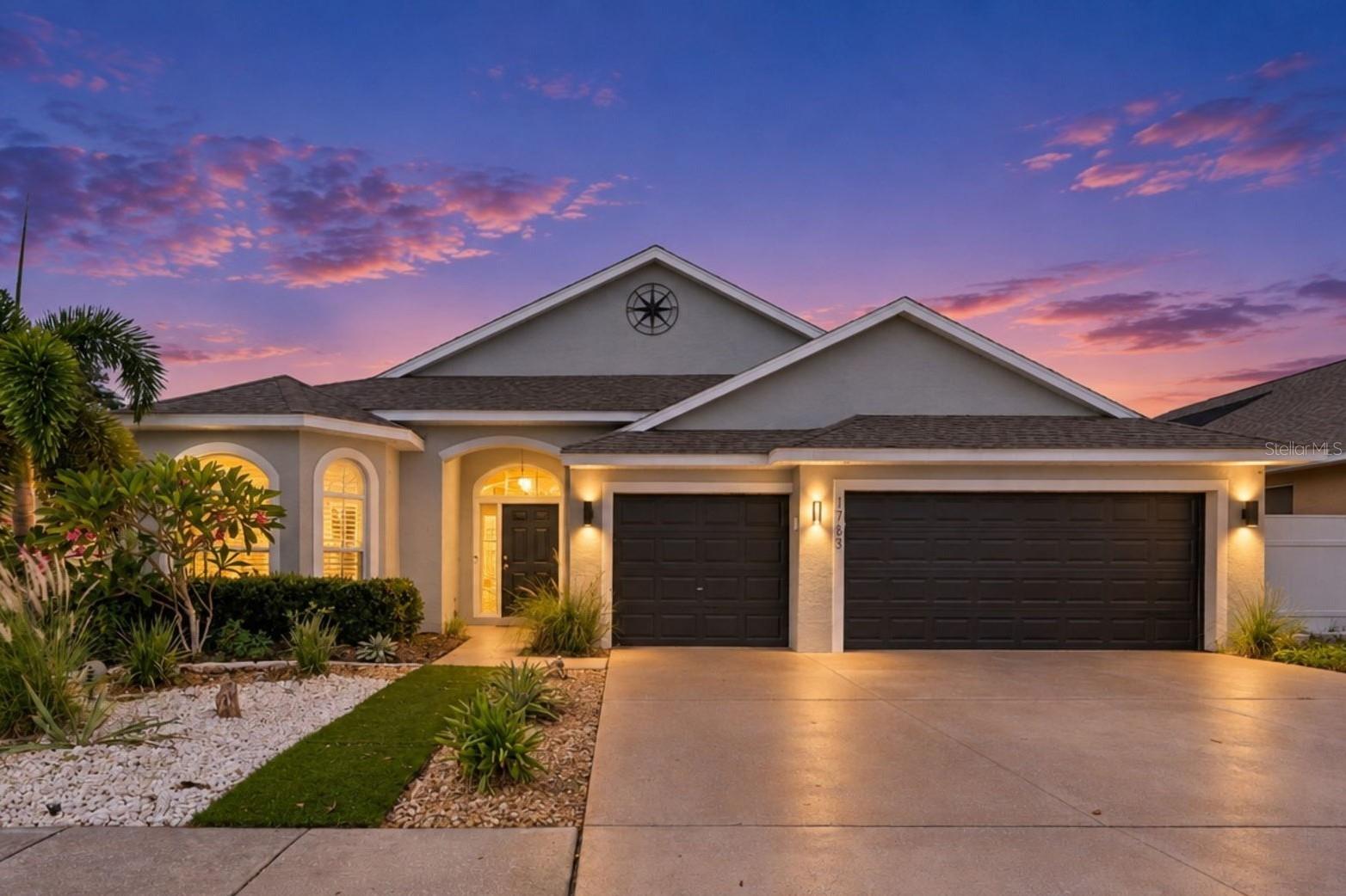 Enter the gated community of Forest Ridge and discover this beautiful 4 Bedroom, 2 Bath 3 Car Garage PoolHome, updated and ready for you to move in. Enter this spacious home in the evening where the tropicallandscaping and elegant uplighting set the stage for an elegant entrance to this home. A spacious foyer welcomes you inside to view this open floor plan to the inviting pool beyond. A formal Living Room and offsetDining Room provide a flexible space with a view. The upscale Kitchen has granite counters, plenty of cabinets and prep space, breakfast bar, table space, removable island , closet pantry and is adjacent to an insideLaundry Room with extra shelf storage and a utility sink. The Kitchen overlooks a spacious family room with awood burning fireplace and a view and sliders to the Pool. Notice the gentle arches, the soaring ceilings, the artful roomplacement, attention to detail and light & bright spaces. The front Bedroom is currently being used as anoffice adjacent to the bath with a beautiful bay of windows. The Master Bedroom is spacious, has sliders toand a view of the pool, and a large Master Bath with granite Dual Vanity Sinks, a soaking Tub and separateShower. The split bedroom plan places Bedrooms 3 & 4 adjacent to the Hall Bath off a separate hallway. The Salt water pool area has solar assit heat, newly rescreend pool enclosure, covered lanai with ceiling fans and a utility shed. The upgrades and features are too numerous to mention and are on an attached sheet including Roof 2018, AC 2024, Hot Water Heater 2026, whole house Interlock Generator with 2 propane tanks (100 gallons each), new Rainbird Sprinkler controller and sprinkler heads and more. Forest Ridge is located near Gulf Beaches & famed Sponge Docks with great food, shopping, boat tours, festivals and entertainment. Come live the fun Florida Lifestyle!