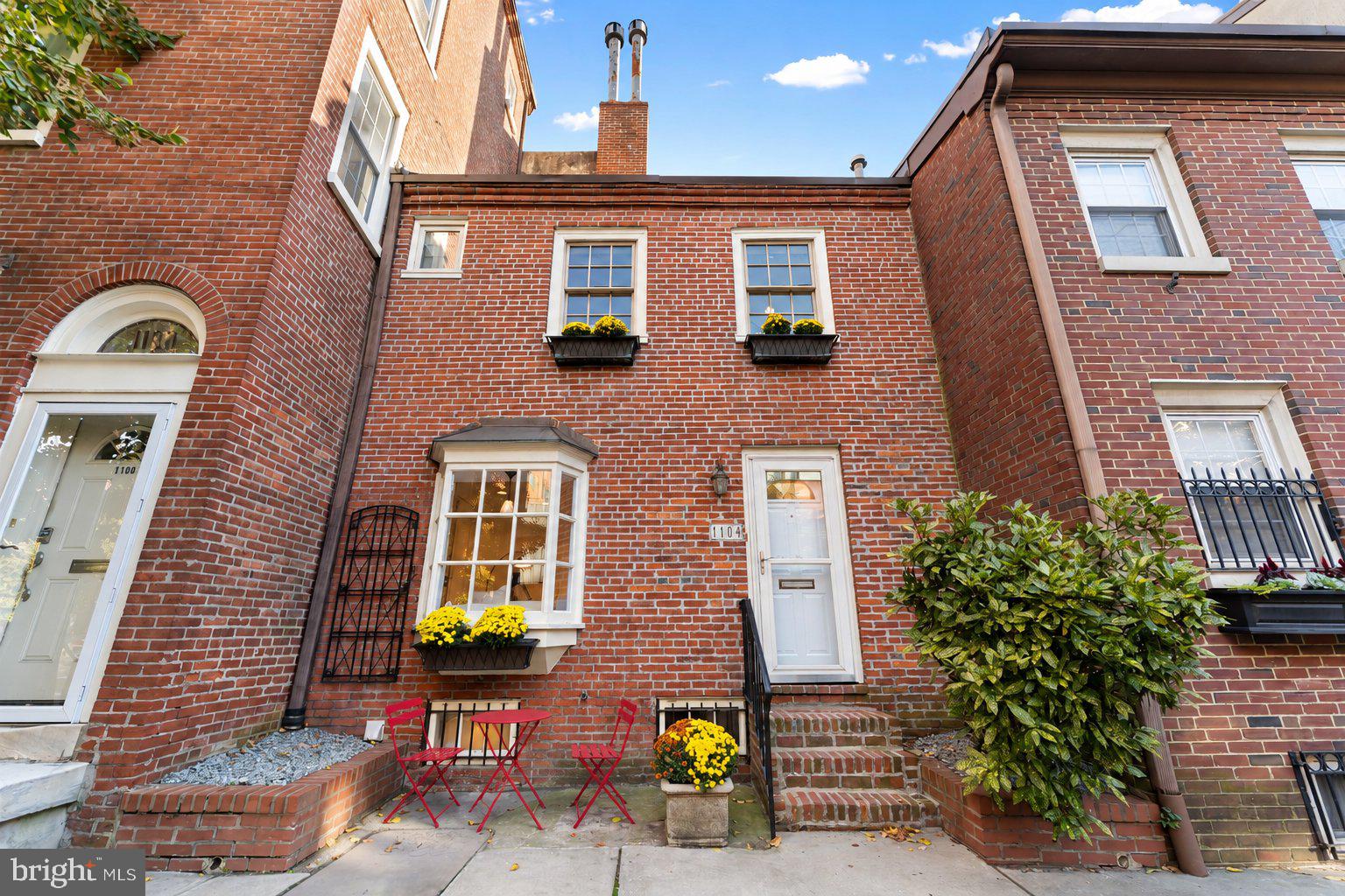 Welcome to your charming new rowhome in Washington Square West, with Seger Park just steps from your front door! Enjoy two tennis courts that double as pickleball courts, a playground, basketball courts and a dog park recognized by CBS among Philadelphia’s best. Morning coffee is within two blocks, and Whole Foods and ACME are around the corner. Jefferson, Pennsylvania Hospital, the Kimmel Center, Midtown Village, the Italian Market and Angelo’s Pizzeria are all within about a 10-minute walk. Washington Square, Reading Terminal Market and Rittenhouse Square are within 20 minutes on foot. 1104 Lombard Street gives you the charm and privacy of a classic Philadelphia rowhome with the ease of low-maintenance condo living. Your own private entrance opens directly onto Lombard Street, with no shared hallways and no elevators! Own a piece of Philadelphia history in pet-friendly Washington Mews, where condominium living in Pennsylvania began. Owners also have access to the community’s gated, landscaped courtyard. The monthly condo fee includes property insurance, exterior building maintenance, landscaping, snow removal, and upkeep of the courtyard and common areas. The current owner has remodeled the home with a brand-new custom kitchen, all-new appliances, updated bathrooms, and refinished hardwood floors throughout. Step inside to a sunlit living room with hardwood floors, fresh paint, oversized windows facing Lombard Street, and the first of two gas fireplaces. It’s an inviting setting for entertaining friends or a quiet evening by the fire. Downstairs, the completely transformed kitchen and dining area feature brand-new custom cabinetry, marble-look quartz countertops and backsplash, and an island. The all-new premium appliance package includes a Bertazzoni 30-inch Professional range, Fisher & Paykel refrigerator, Bosch dishwasher, and Viking microwave. Pick up fresh ingredients at the Italian Market, then come home and put your new Bertazzoni range to work! A new Bosch washer/dryer adds the convenience of laundry at home, and an updated powder room with new fixtures and a backlit mirror completes this level. Upstairs, the bedroom features its own gas fireplace, refinished hardwood floors, new lighting, and two closets, including a spacious walk-in. The adjoining full bath has also been refreshed with updated fixtures and a backlit vanity mirror. Additional improvements include a new water heater, Schlage smart lock entry, and a security system. Public transportation and parking facilities offering monthly options are nearby. Enjoy the character and privacy of your own Philadelphia rowhome, plus the convenience of condo living and everything Center City has to offer. Schedule your private showing today!