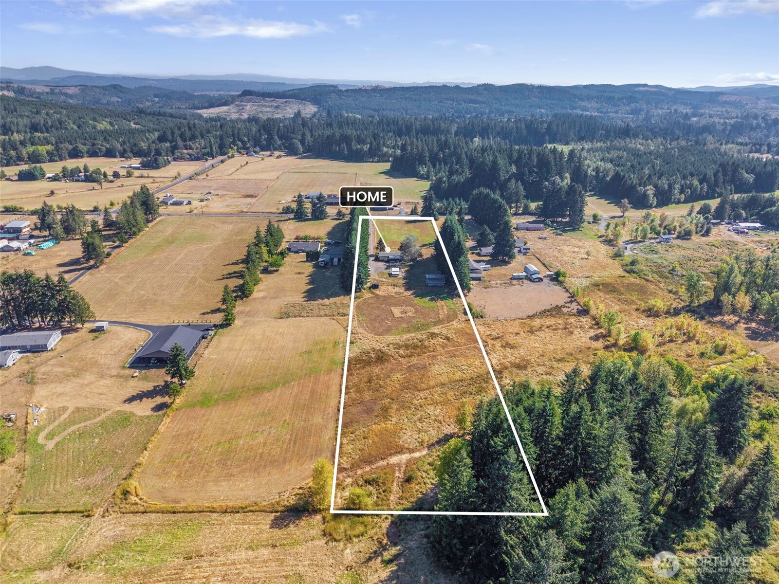 Here is your opportunity for a beautiful mini-farm/horse property.  This includes 5+ acres of flat, excellent land, a great barn, and a very comfortable, affordable home.  The house has a new roof, all new solid-surface flooring throughout, new baseboard trim, new light fixtures, newly built front porch and a beautiful new kitchen.   Trust me  - you will love the new floors.  You absolutely can't find a better location. Three bedrooms, two full bathrooms. Outbuildings and tons of possibilities.