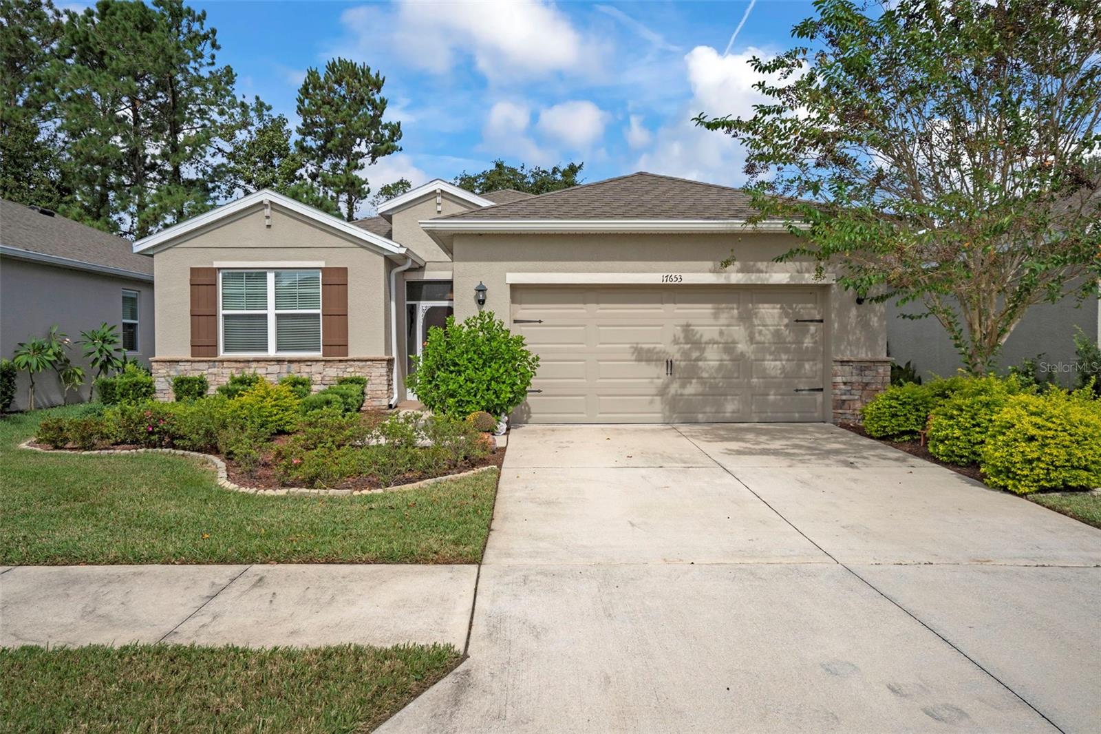 Welcome to this lovely, move-in ready 3-bedroom, 2-bath single-family home nestled in the sought-after-gated golf course community of Hernando Oaks. With no rear neighbors and tucked away on a quiet circle with just 45 homes, this property offers exceptional privacy with unmatched convenience.  Built in 2019 and offering over 1600 square feet of heated living space, this home features a thoughtfully designed open floor plan with loads of closet space and a gorgeous view of the golf course. Step into the heart of the home—an upgraded kitchen boasting granite countertops, stainless steel appliances, an abundance of cabinetry, and a spacious walk-in pantry. Enjoy the outdoors year-round from your glass and screen enclosed sunroom which leads to a large 11’ x 16’ wooden deck perfect for outdoor entertainment and/or relaxation.  Inside, your primary bedroom features an en-suite bathroom with granite counters and dual vanities as well as a large walk-in closet.  A 3-way split floor plan ensures privacy from each bedroom. Laundry is a breeze with your sizable laundry room boasting added cabinets as well as an additional standing freezer.  Your lawn is maintained by the HOA and included in your low HOA fee.  Community features include a golf course, driving range, pro shop, on-site restaurant as well as pickleball courts. With no CDD’s and no flood insurance required, this home will not last.  Don’t miss your chance to own this move-in ready gem in one of Hernando County’s most desirable communities with quick access to US-41 and the Suncoast Parkway for an easy commute to Tampa, airports, and the Gulf beaches. Schedule your private showing today!