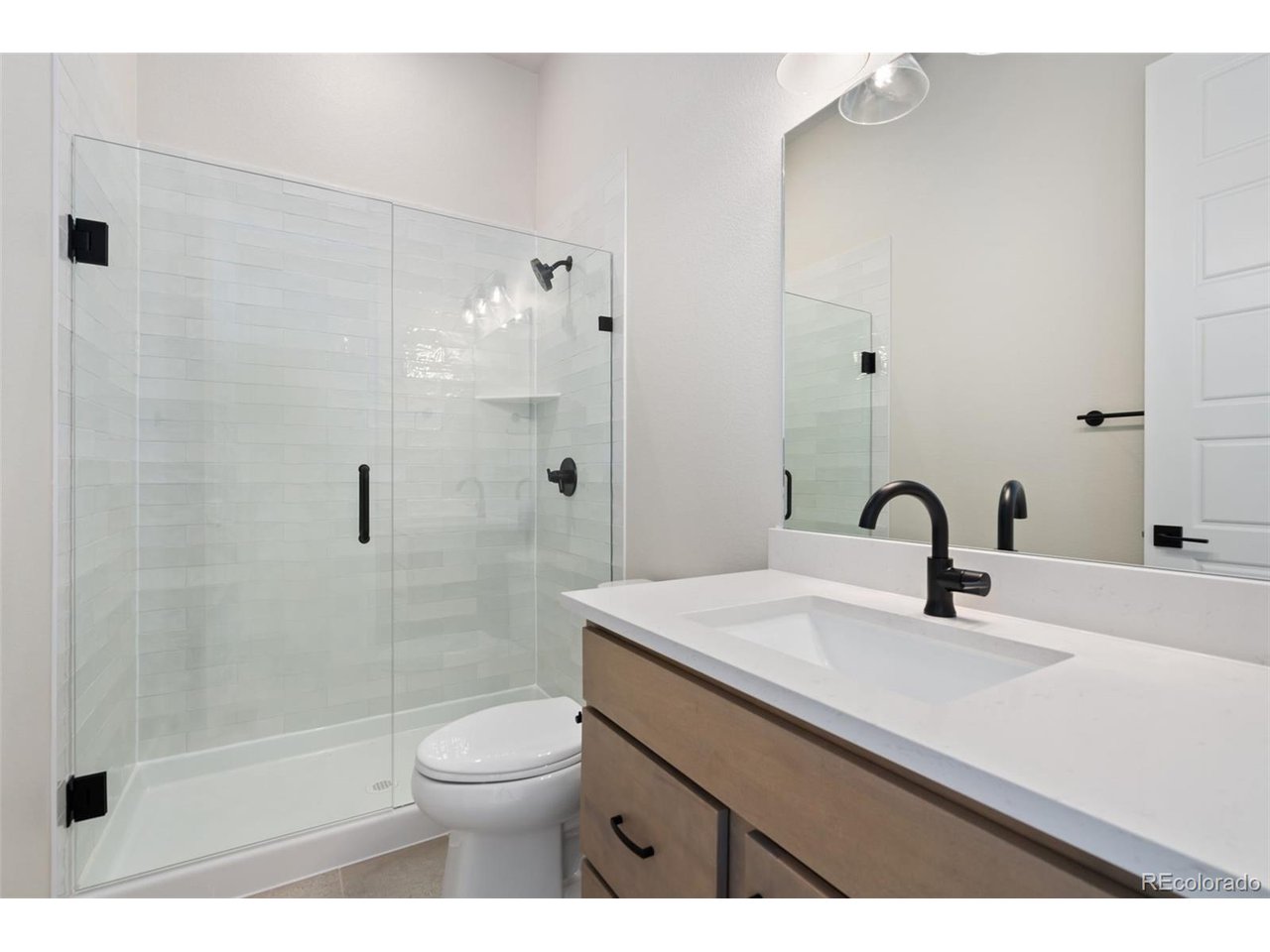 Builder Incentive of up to 6% when using preferred lender could allow approx. $47K towards allowable closing costs/prepaids and rate buy down. This can save you hundreds of dollars each month! Plan 2 at Festival at RainDance by Trumark Homes is a contemporary single-story home offering 2,230 Sq. Ft. of living space with three bedrooms and two and a half baths. The home features an inviting porch with secondary bedrooms and office just through the entrance hall. Beyond the entry you'll enter the gourmet kitchen featuring a spacious walk-in pantry and a center preparation island. This island includes a deep, single bowl composite sink that overlooks the dining and great rooms, complete with a modern gas fireplace. The kitchen features "Moonlight" stained Shaker style cabinetry, Carrara Marmi quartz countertops with tile backsplash, stainless steel appliance package with 5-burner gas cooktop, convection oven, built-in microwave, and dishwasher. The great room and dining room open to the covered outdoor room. The primary suite, located just off the great room offers a stunning, spa-like bathroom with a walk-in shower and an inviting freestanding tub. An expansive walk-in closet completes the primary suite. This beautiful home will be move in ready, complete with full yard landscaping and fencing. Neighborhood amenities of walking trails, orchards, non-potable water and trash, are included in your metro district fees. Membership to the Raindance pool is optional and currently $510/year; there are also other membership options combining amenities in Raindance and nearby Water Valley - "WaterDance"!