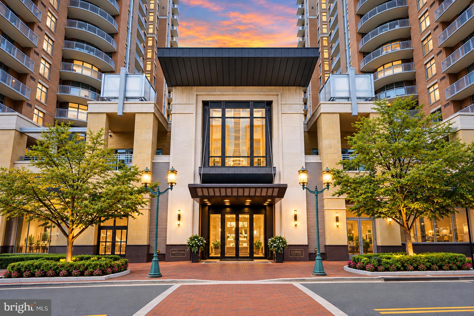 3 BEDROOMS. 2 BATHROOMS. 2 PARKING SPACES. 2 STORAGE UNITS. All in the heart of Reston Town Center — and offered under $1 million.This is the downsize that lets you keep the things you love about your current home while leaving much of the maintenance behind. Three-bedroom condos in Midtown at Reston Town Center are hard to come by. A 3-bedroom residence with TWO assigned garage parking spaces and TWO private storage units is even harder to find.Welcome to 11990 Market Street #417, a spacious and beautifully refreshed 3-bedroom, 2-bath condo overlooking the Midtown pool. Completely repainted in Benjamin Moore Winds Breath, the residence feels warm, sophisticated, and move-in ready. New luxurious carpeting has been installed in all three bedrooms, while hardwood floors anchor the generous living room. Floor-to-ceiling windows bring in abundant natural light, and the private balcony provides a peaceful outdoor space overlooking the pool.The kitchen is polished and timeless with gray cabinetry, black granite countertops and marble flooring that continues into the dining area. The guest bathroom has also been recently updated with classic finishes.And then there is the SPACE.Three true bedrooms give you room for overnight guests, a home office, or hobbies. Two garage parking spaces make two-car living easy. Two separate storage units mean bikes, luggage, holiday decorations, golf clubs, and the things you aren't ready to part with don't have to compete for space inside your home.Outside your door is everything that makes living in Reston Town Center so appealing: restaurants, coffee shops, shopping, fitness, entertainment, community events and the Reston Town Center Metro station. Inside Midtown, enjoy concierge service, a pool, fitness center and resident amenities in one of Reston's most established luxury condominium communities.For buyers ready to simplify without sacrificing space, location, or convenience, #417 is a rare combination.3 bedrooms. 2 bathrooms. 2 parking spaces. 2 storage units. Reston Town Center. Under $1 million.Downsize the maintenance. Not your life.