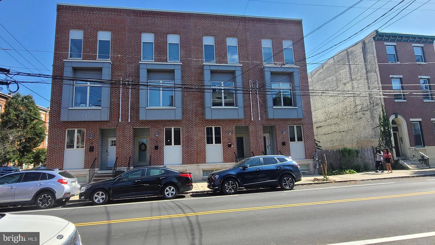 Welcome to desirable Fishtown, one of Philadelphia's most sought-after neighborhoods! This beautiful newer-construction, end-unit townhome condominium offers 2 bedrooms, 1.5 baths, and a wonderful combination of modern finishes, architectural character, and comfortable living. From the moment you enter, you'll appreciate the abundance of natural sunlight pouring through oversized windows, soaring ceilings, and recessed lighting throughout. The spacious living room features a stunning custom brick accent wall and an open layout that flows effortlessly into the kitchen and dining areas. The beautifully appointed kitchen is sure to impress, featuring stylish concrete countertops, subway tile backsplash, soft-close cabinetry, abundant counter and cabinet space, a convenient breakfast bar, and a separate eating area. A spectacular corner arrangement of windows fills the kitchen with natural light while offering beautiful neighborhood views, creating an inviting space to start or end your day. The lower level features two generously sized bedrooms with ample closet storage and tile flooring. The beautifully finished full bathroom offers decorative tile flooring, a vanity with storage, and a tub/shower combination with attractive tile surround. Additional highlights include multiple storage areas throughout, gas heating, central air conditioning, and a convenient first-floor powder room. Location, location, location! Enjoy all that Fishtown has to offer, including its vibrant neighborhood atmosphere, popular restaurants, cafés, shopping, and entertainment. Combining contemporary finishes, exceptional natural light, and a highly desirable location, this beautiful home is an opportunity you won't want to miss. Schedule your showing today!