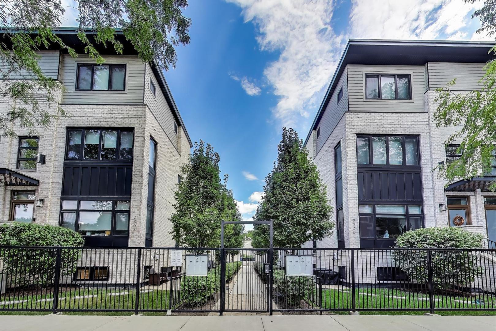 Better than New! Welcome to this 2020-built new construction townhome in the heart of Logan Square, offering 4 bedrooms, 3 full baths, and incredible outdoor space. This bright and sunny end unit is filled with natural light from oversized windows and showcases high-end finishes with thoughtful attention to detail throughout. The open-concept main level features a chef's kitchen with Bosch appliances, 42" custom cabinetry, open shelving and quartz countertops, seamlessly connecting to the spacious living and dining areas. Upstairs, find two generous bedrooms, a stylish full bath with double vanity, and a well-designed laundry room. The third-floor primary suite is a true retreat with a custom walk-in closet and a spa-like bath featuring a double vanity, heated floors, and a walk-in shower. The lower level offers soaring ceilings, a large guest suite (or family room + home office), and an additional full bath. Outdoor living is unmatched with one of only two private garage roof decks that has been fully customized for outdoor living, a top-floor rooftop deck with sweeping treetop views, and a private backyard ready for your personal touch. Additional highlights include: attached garage parking, tons of thoughtful updates, and an unbeatable location directly across from coveted Goethe Elementary and steps from its playground and park. Surrounded by vibrant retail, dining, nightlife, and convenient transit, this home offers the very best of city living at Rockwell Square. Don't miss this opportunity!