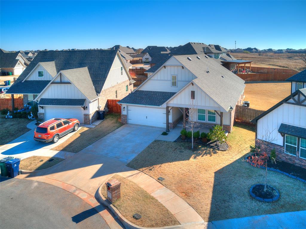 This beautifully maintained Edmond residence has 2056' with Tall 10'Ceilings has 3 Beds,3.5 Baths, 3 Car Garage, 2 Living Areas, & a Large Open Kitchen with a Large Island with Stainless Appliances & White Quartz Countertops. This home offers the perfect blend of elegance, comfort, & modern living with crown molding for detail.  Nestled on a culdesac in the back of the neighborhood, this home backs up to greenbelt with no homes directly behind you & a see through wrought iron fence looking onto the greenbelt! Large oversized Lot & the  Upstairs is only a 2nd Living Room/Bonus Room/Media Room with a Full Bath. All Bedrooms are Downstairs. When you step inside to soaring ceilings, abundant natural light & an open thoughtfully designed floor plan that enhances both daily living & entertaining.  The home has 2 Fireplaces: Gas Log Fireplace in the Downstairs Living Room (open to Kitchen) & the Outdoor Fireplace is Wood Burning on the Covered Patio. A Tankless Hot Water Tank, Sprinkler System, & a Storm Shelter are all in the garage. Garage is a 3 Car with one Bay being a tandem (double) space for the third space. The Primary Bedroom suite is a true retreat boasting a spa inspired ensuite with two vanities/sinks, Large Tub, separate shower & toilet (water closet), & large Walk-in Primary closet to fill up! Outside enjoy Oklahoma sunsets on the covered patio overlooking a well maintained backyard- ideal for pets, play, or simply unwinding! Located in Edmond, Oklahoma & Blue Ribbon Award Winning Deer Creek Public Schools, this home has easy access to Highway 74 & Kilpatrick Turnpike, restaurants, shopping, & all the amenities of North OKC & Edmond. This home offers unbeatable value, in one of the most desirable areas in the metro! Immaculate Condition with Exceptional Layout & Location! The Grove has a Fitness Centers, 2 pools, a lake with walking trails, multiple parks, and greenbelt. Call now to set up a showing!