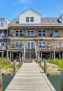 Spectacular Waterfront 5 Bedroom, 4.5 Bathroom home w/ sweeping views of the lighthouse & the  Assateague Channel. Enjoy the Best Flounder fishing & crabbing on the island off the renovated 60' dock (w/ deep water @ 22') or entertain friends & family in this expansive well appointed home. 1st floor Bedroom, Double kitchen, multiple decks: there is truly a place for everyone to spread out.  Enjoy the fresh ocean breezes or watch the Pony Swim from the 1st & 2nd floor decks! The house is built to withstand hurricane-force winds.  All floors are double ” plywood. 2”x6” stud walls w/ plywood inside & out w/ 1.25” of sheetrock on the inside.  Pilings are oversized & in excellent shape. Several Improvements: New Roof-2022. All 3 Heat Pumps Replaced-2024. Cooktop & Double oven-2023.  COME SEE!
