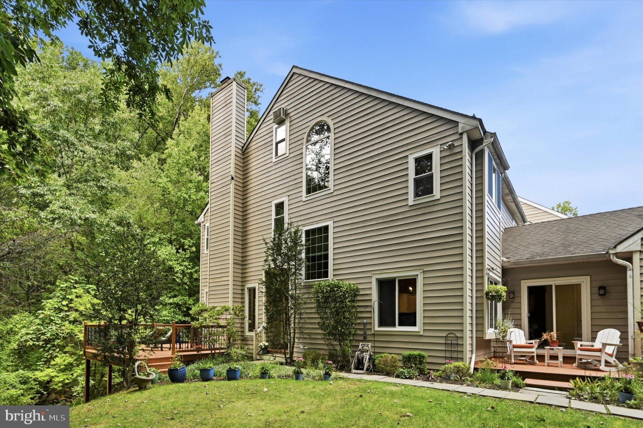 This stunning 3 BR, 3 1/2 bath townhome is a truly exceptional residence. A sun-drenched END UNIT set within a lush, park like landscape overlooking a tranquil brook, it offers rare privacy, with only one adjoining neighbor and uninterrupted nature on two sides due to its cul-de-sac location. The garden facing front entrance opens to a mostly private yard framed by mature trees and shrubs and complemented by three decks for refined outdoor living. The perennial garden features honeysuckle & black eyed Susans & more. Thoughtful upgrades and design elements elevate this townhome’s expansive interior.  Despite its serene setting, the home is located near Marple Newtown schools, SEPTA/Amtrak trains, the Blue Route/PA Turnpike and KOP mall. This is the perfect home for those that are downsizing or starting a family, who wish for the space of a house, without the responsibilities of a single-family residence. New Windows & skylights (2026/20), New HVAC (2025) & New 500 sq. ft wrap around deck (2026). First floor: Foyer & Living Room: An inviting, light filled entrance welcomes you into a home defined by craftsmanship and comfort. The foyer with custom bookcases leads to a dramatic sunken LR with 9 ½ foot ceilings and a wood burning fireplace framed by a bespoke mantel, crown molding, and oak trim. Two 8-foot sliding glass doors open to the new 500 sq ft wrap around deck, creating a seamless indoor-outdoor experience with breathtaking nature views.Kitchen: The Mediterranean inspired eat in kitchen features a hand-crafted wooden ceiling beams & door frame, hand painted tile, and warm natural hardwood floors. Granite countertops, a double sink, island & stainless steel appliances—including a 5 burner stove enhance both beauty and function. The kitchen opens to the 2nd deck (121 sq ft - 11x11), ideal for elevated entertaining, and evening cocktails. The hardwood floors continue down the hall to a powder room showcasing a unique vessel sink, walk in closet and attached 1 car garage access. Garage offers space for shelving and guest parking spaces are conveniently located next to the unit.Second floor: The Master Suite overlooks the valley, offering a serene retreat with a custom California Closet. The fully remodeled skylit bathroom includes granite counters, a jacuzzi tub, separate steam shower, dual vessel sinks with waterfall faucets—creating a spa like sanctuary. The Guest Suite is bathed in natural light by the triple windows. Custom blinds, drapes,  with matching headboard/ bed skirt and a generous closet complete the space. This suite includes an upgraded ensuite bathroom  with bathtub, new vanity & toilet.Third floor: Loft Bedroom: A spacious, skylit space with full ensuite bathroom, ialso an excellent option for a home office.Basement: This fully finished area serves as an inviting family game room or gym area and features a gas fireplace with custom painted stone, built in bookcases, and new carpeting/padding. The space opens to the third deck (20x10) with enchanting forest views. A finished laundry room includes cabinet storage and a utility sink. An additional crawl space provides ample storage. Existing plumbing & sewer connections allow for a future wet bar or bathroom.Located within the highly regarded Marple Newtown School District, this home offers the perfect blend of convenience, comfort and location. Move right in and enjoy low-maintenance living in a desirable community with everything you need right at your fingertips. A wonderful opportunity to enjoy an easy, effortless lifestyle in a truly unbeatable location. Schedule your appointment today!