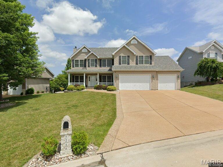 THIS HOUSE IS SOMETHING SPECIAL! Packed with SPACE, UPDATES & WOW FACTOR, this is the kind of home you have to SEE to fully appreciate! Fresh paint & NEW carpet throughout, updated lighting, dual furnaces (11/23) & dual A/C (5/22) set the stage. The main level offers a private office w/French doors plus an incredible family room with Tiger Strand bamboo floors, bay window, open staircase & wood-burning fireplace. The kitchen DELIVERS with 42" cabinetry, GRANITE counters, SS appliances, center island w/breakfast bar, crown molding, recessed lighting & breakfast room with another bay window! Upstairs just keeps getting BETTER! A HUGE loft offers incredible bonus living space, while the MASSIVE primary suite feels like its own private retreat with vaulted ceilings, TWO walk-in closets & a spacious bath with double vanity, soaking tub & separate shower. NOW FOR THE REAL SHOWSTOPPER—THE FINISHED WALKOUT LOWER LEVEL! This isn't just a basement...IT'S PRACTICALLY ANOTHER HOME! With a LARGE bedroom featuring an oversized window for lots of light, FULL bath PLUS half bath, huge rec room, spacious living room with walkout AND a COMPLETE SECOND KITCHEN, this level offers incredible possibilities for MULTI-GENERATIONAL LIVING, IN-LAW QUARTERS, extended-stay guests or an amazing private living space! And then there's THE BAR! Not a little basement wet bar—we're talking YOUR OWN PUB! A gorgeous full-size bar anchors the entertainment space and the second kitchen comes loaded with QUARTZ counters, smooth-top stove, microwave & dishwasher. Football Sundays, holidays, poker nights or the biggest party of the year—YOUR HOUSE WILL BE THE HOUSE EVERYONE WANTS TO BE AT! DON'T MISS THE GARAGE! Heated AND cooled, 4' extended in front, 8' extended rear 3rd bay, 2' wider, utility sink, newer shaft-drive openers & enough space to potentially accommodate FOUR VEHICLES. This is a DREAM setup for cars, toys, hobbies or a workshop! THEN STEP OUTSIDE TO YOUR OWN BACKYARD RETREAT! Gather around the gorgeous STONE FIREPLACE, listen to the relaxing WATERFALL FEATURE, entertain on the massive 19x19 stone paver patio or 25x14 deck, and there's even a dedicated concrete pad ready for your hot tub! Add in the fully fenced yard, mature shade trees & BEAUTIFUL landscaping and this backyard is made for unforgettable nights with family & friends. THREE LEVELS OF INCREDIBLE LIVING SPACE. A LOWER LEVEL THAT CAN LIVE LIKE A SECOND HOME. A DREAM GARAGE. YOUR OWN PUB. AND A BACKYARD THAT FEELS LIKE A PRIVATE RETREAT. THIS ISN'T YOUR AVERAGE HOUSE—THIS IS THE ONE YOUR FRIENDS WILL BE JEALOUS OF!