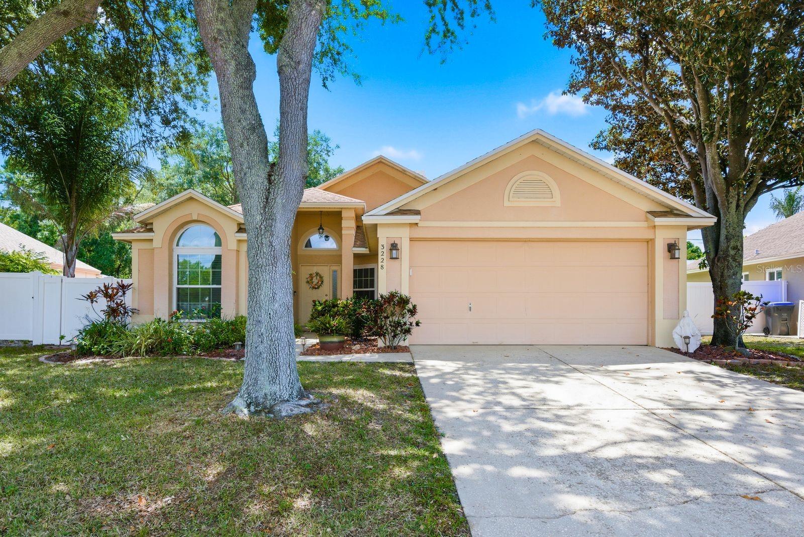 Welcome to your dream home in the heart of Palm Harbor! This stunning four-bedroom, three-bathroom residence offers 2,518 square feet of thoughtfully designed living space with a desirable three-way split floor plan that gives everyone their own breathing room.Step inside to discover a formal living room and dining room perfect for hosting memorable gatherings. The family room features a cozy wood-burning fireplace, creating the ideal backdrop for relaxing evenings. The updated kitchen is a true showstopper, boasting rich wood cabinetry, granite countertops, a convenient breakfast bar, generous pantry, and storage that would make any home chef swoon.The expansive primary suite is a private retreat with an adjoining bonus room offering incredible versatility as a study, den, or even an in-law suite. A small office tucked nearby makes the perfect craft room or quiet workspace. The additional bedrooms are generously sized and served by two well-appointed bathrooms.Now step outside where the magic truly happens. The large screened lanai was built for entertaining, complete with a sparkling pool, relaxing spa, and a dedicated grilling area. The oversized backyard provides endless possibilities for outdoor enjoyment and weekend adventures.Nestled in a highly sought-after neighborhood, this home sits within an acclaimed school district and offers easy access to local attractions, dining, and shopping that make Palm Harbor one of Florida's most beloved communities.This is the kind of home that checks every box. Schedule your private showing today before someone else falls in love first!