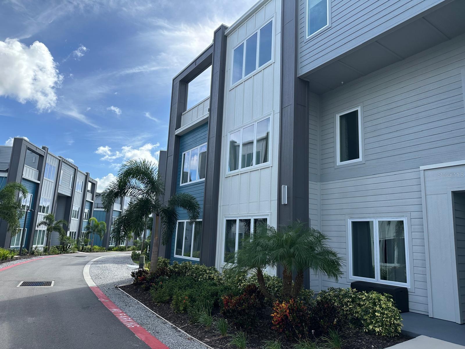 Welcome to Spectrum Resort, your perfect getaway just minutes from Disney and Orlando’s world-famous theme parks. This stunning 3-bedroom, 3-bathroom condo offers the ideal blend of luxury, comfort, and convenience, highlighted by a spacious private terrace overlooking a beautiful golf course. The contemporary kitchen is a true centerpiece, featuring elegant quartz waterfall countertops, premium stainless steel appliances, and a sleek modern design. High ceilings and an open-concept layout create a bright, airy atmosphere that enhances the home’s beautiful style. The residence is offered fully furnished with a professionally designed furniture package valued at over $50,000, making it completely move-in or rental ready. Unlike purchasing from a developer, this property is essentially brand new—without the wait and at a better value. Golf enthusiasts will appreciate the golf membership included, providing access to three well designed private courses: Tradition by Jack Nicklaus, Legacy by Arnold Palmer, and Independence by Tom Watson. Resort-style amenities are truly exceptional. Relax at the 20-acre lazy river water park, enjoy the tennis courts, or stay active in the fully equipped fitness center. The community also features 11 resort-style pools, ensuring there is always a place to unwind and cool off. For added convenience, complimentary shuttles to Magic Kingdom and nearby attractions make visiting the parks effortless. Located in a gated resort community with no rental restrictions, this property offers outstanding flexibility as both a luxury vacation home and a high-potential investment opportunity, ideal for short-term or long-term rentals.