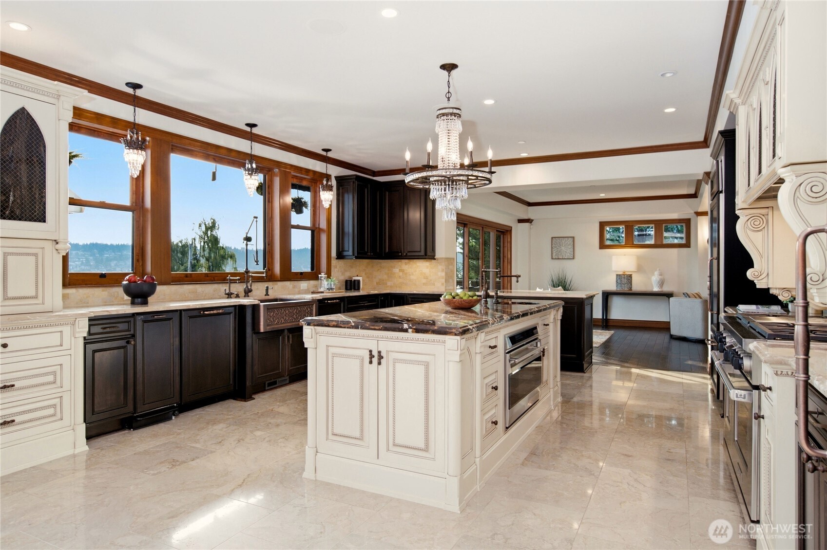 Chef's kitchen designed for entertaining with premium appliances, custom cabinetry and Lake Sammamish views.