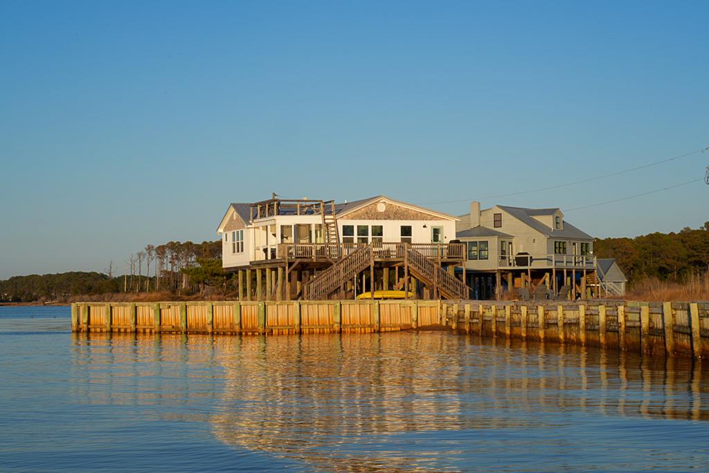 Along a quiet stretch of Virginia's Eastern Shore, Thickett Point is a 44.95 acre waterfront estate offering privacy, scale, and opportunity. With expansive Chesapeake Bay views and no conservation easement, the property provides rare flexibility among coastal holdings.  Two fully furnished waterfront homes—Sunset House and Bayview House—are positioned to capture sweeping water views, supporting both personal use and a proven short-term rental operation generating over $100,000 annually.  Nearly 45 acres of shoreline, marsh, and wildlife habitat offer private beach access, kayaking, hunting, fishing, and crabbing. Located just minutes from Onancock's marinas, dining, and ferry access, Thickett Point is a turn-key Chesapeake Bay retreat with strong income and future upside.