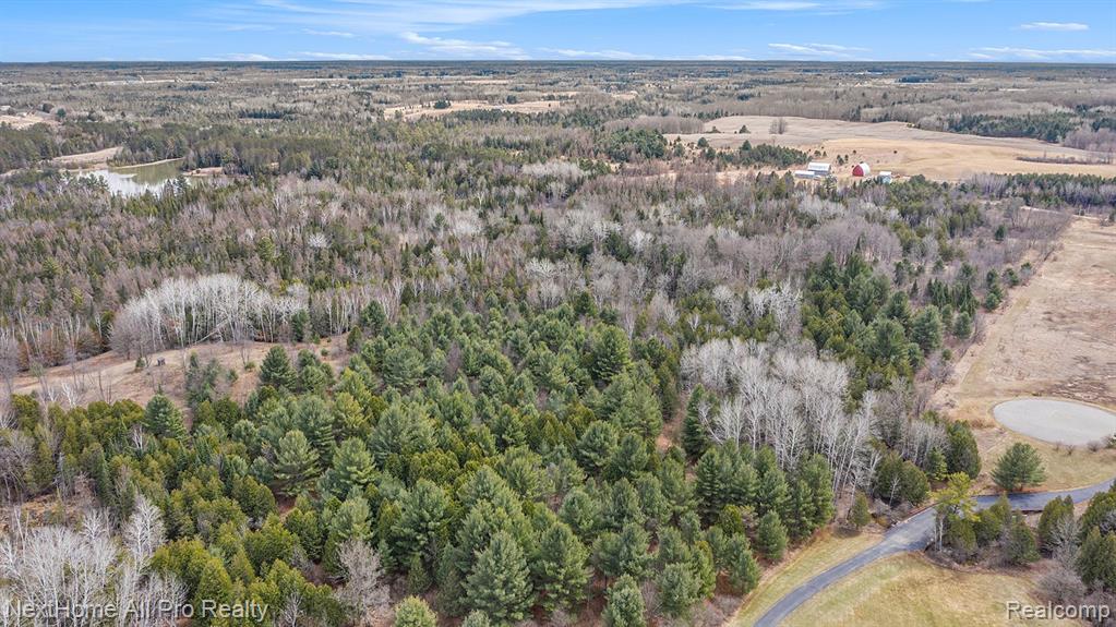 Unlock the potential of this sprawling 80-acre wooded paradise, nestled in the heart of West Branch, Michigan. This unique vacant lot offers endless possibilities for the visionary developer, outdoor enthusiast, or savvy investor. With a range of uses, this property is perfect for those looking to develop a resort that caters to every outdoor activity imaginable, or to create a private hunting lodge that blends luxury with nature. Alternatively, consider a residential development that takes advantage of the scenic surroundings, offering future homeowners a unique lifestyle amid the beauty of Michigan's Great Lakes region.

Located just minutes from the vibrant Victorian downtown of West Branch, you are never far from charming boutiques, delightful eateries, and local breweries and wineries that elevate your leisure time. The Antique Snowmobile Festival brings a dose of nostalgia and excitement, while the nearby lakes and rivers offer boating, fishing, and paddle sports—ideal for creating unforgettable memories with family and friends.